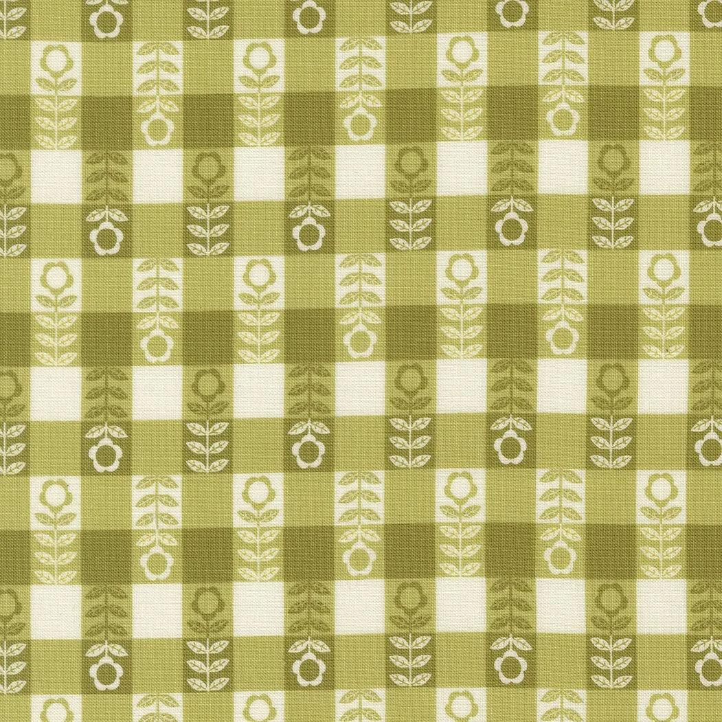 Olive green and white checkered fabric with a floral and leaf pattern.