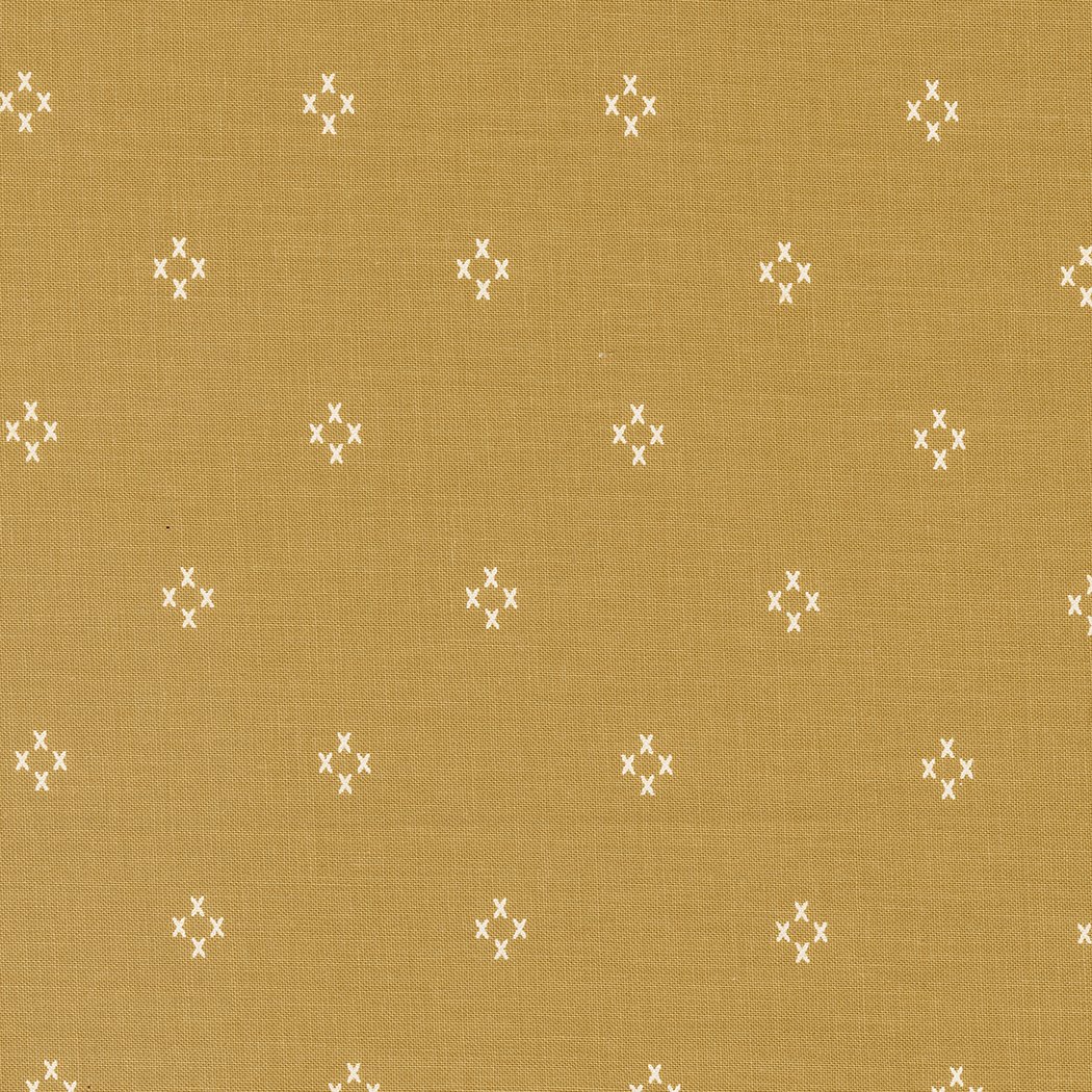 Pattern of small white X's arranged in clusters on a tan background.
