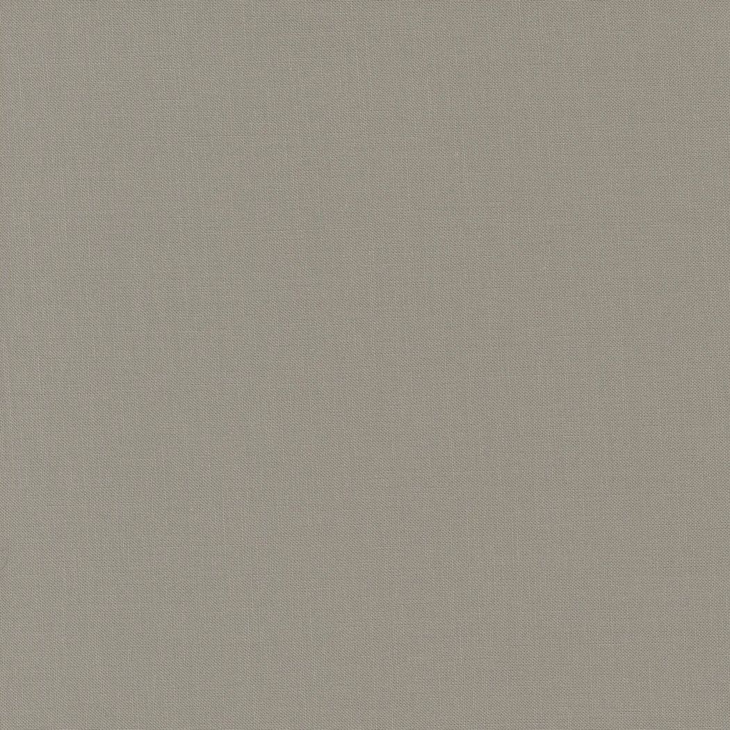 The image shows a plain, textured beige fabric background.