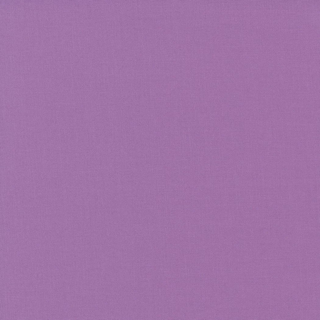 A plain purple fabric background.