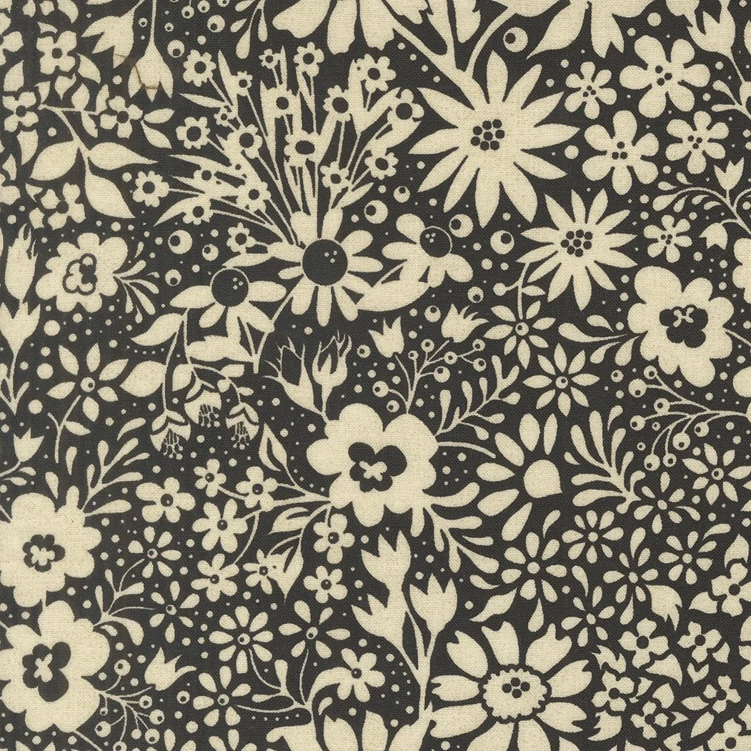 Black and white floral patterned fabric with various flowers and leaves.