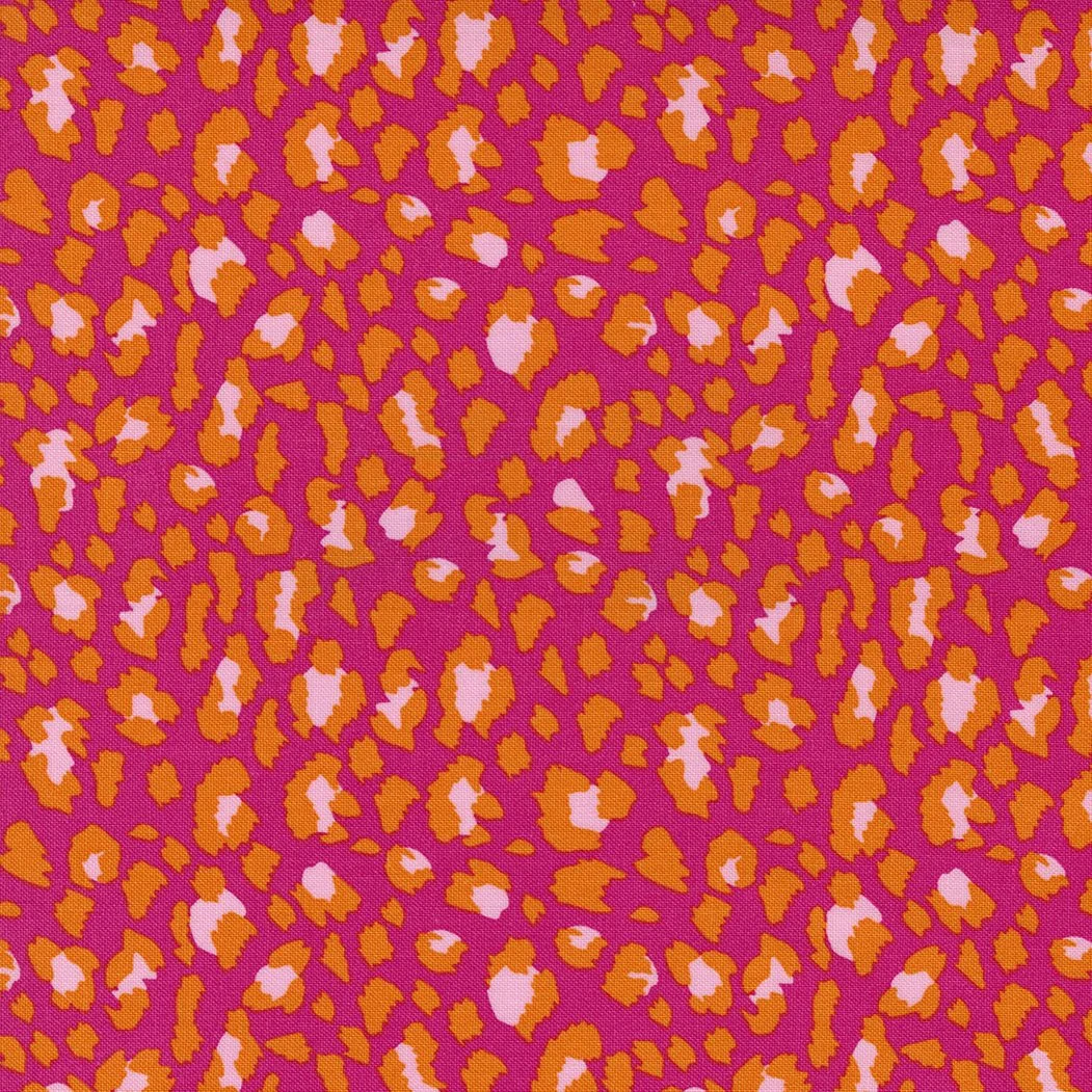 Pink fabric with an orange and light pink leopard print pattern.