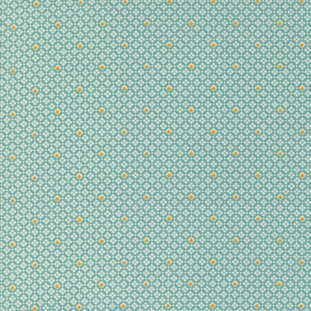 Close-up of a patterned fabric with small white lattice designs on a aqua background, accented by scattered yellow dots.