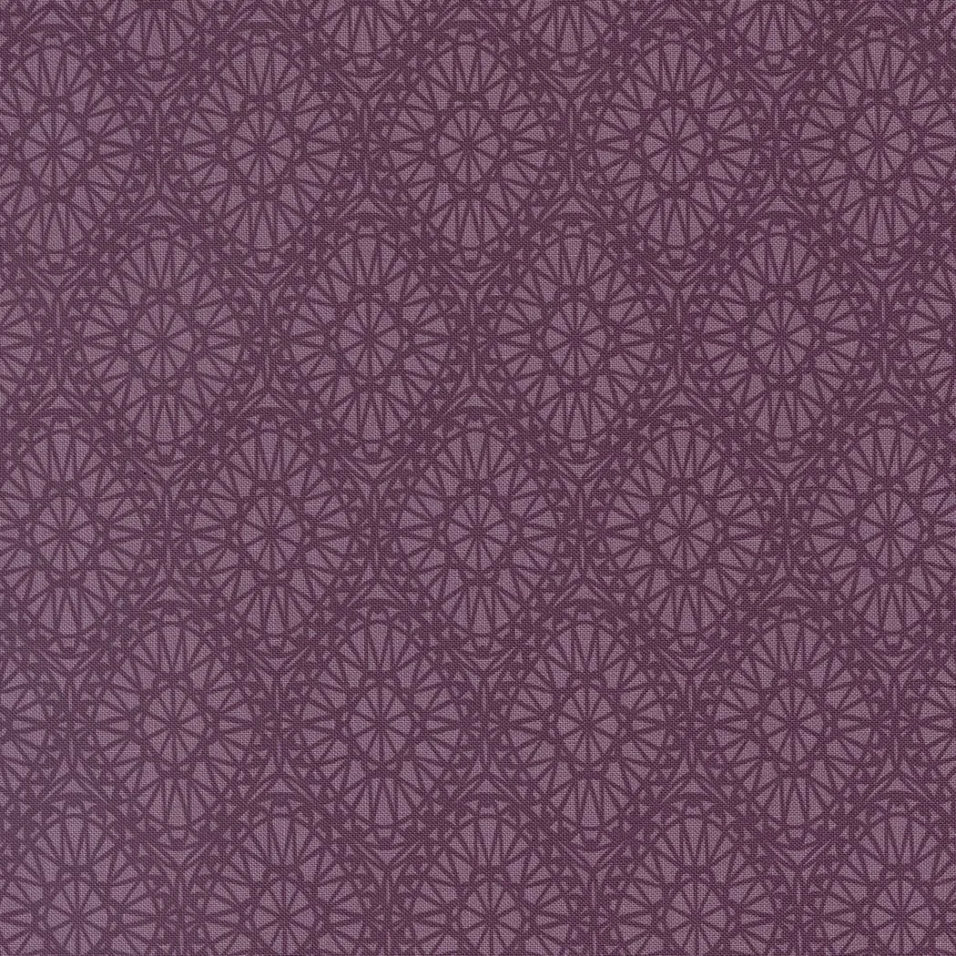 Brown fabric with a geometric pattern of interconnected circles and lines.