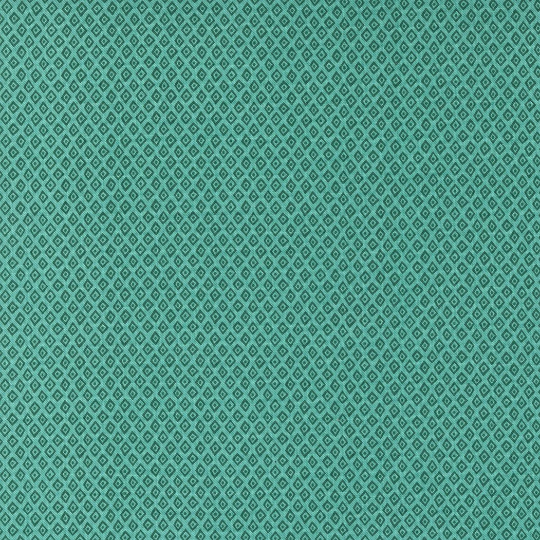 Close-up of a teal fabric with a pattern of small, evenly spaced diamond shapes outlined in darker teal.