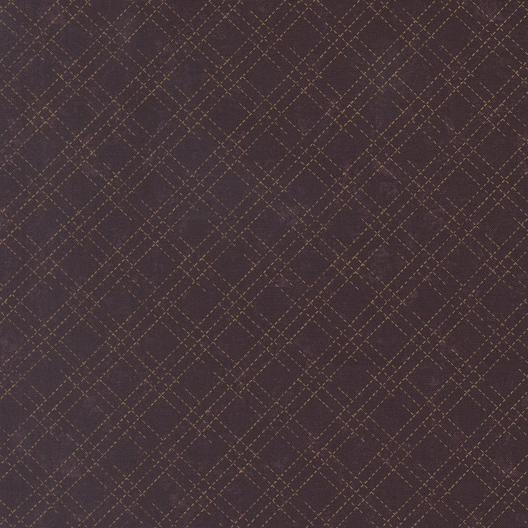 Close-up of a purple fabric with a gold diamond-shaped plaid pattern.