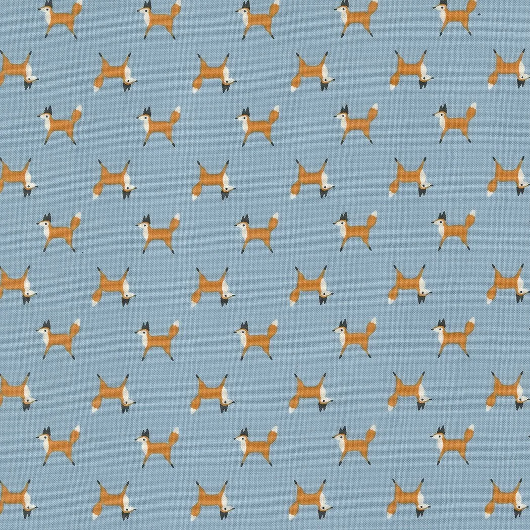 Pattern of cartoon foxes on a blue background.