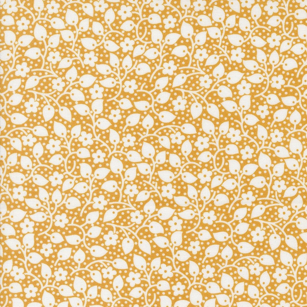 Orange and white floral and leaf pattern fabric or wallpaper