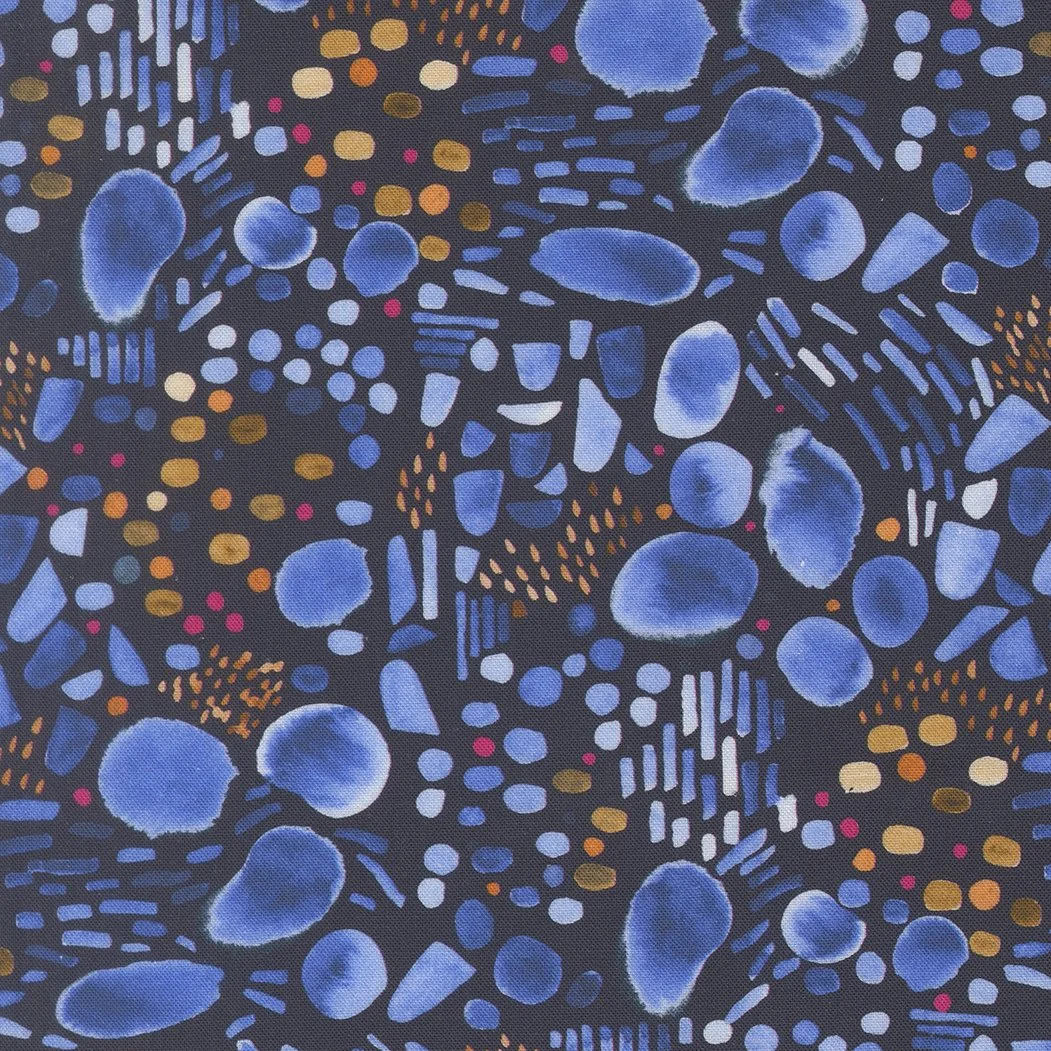 Abstract pattern with blue, orange, yellow, white, and red spots and streaks on a dark background.
