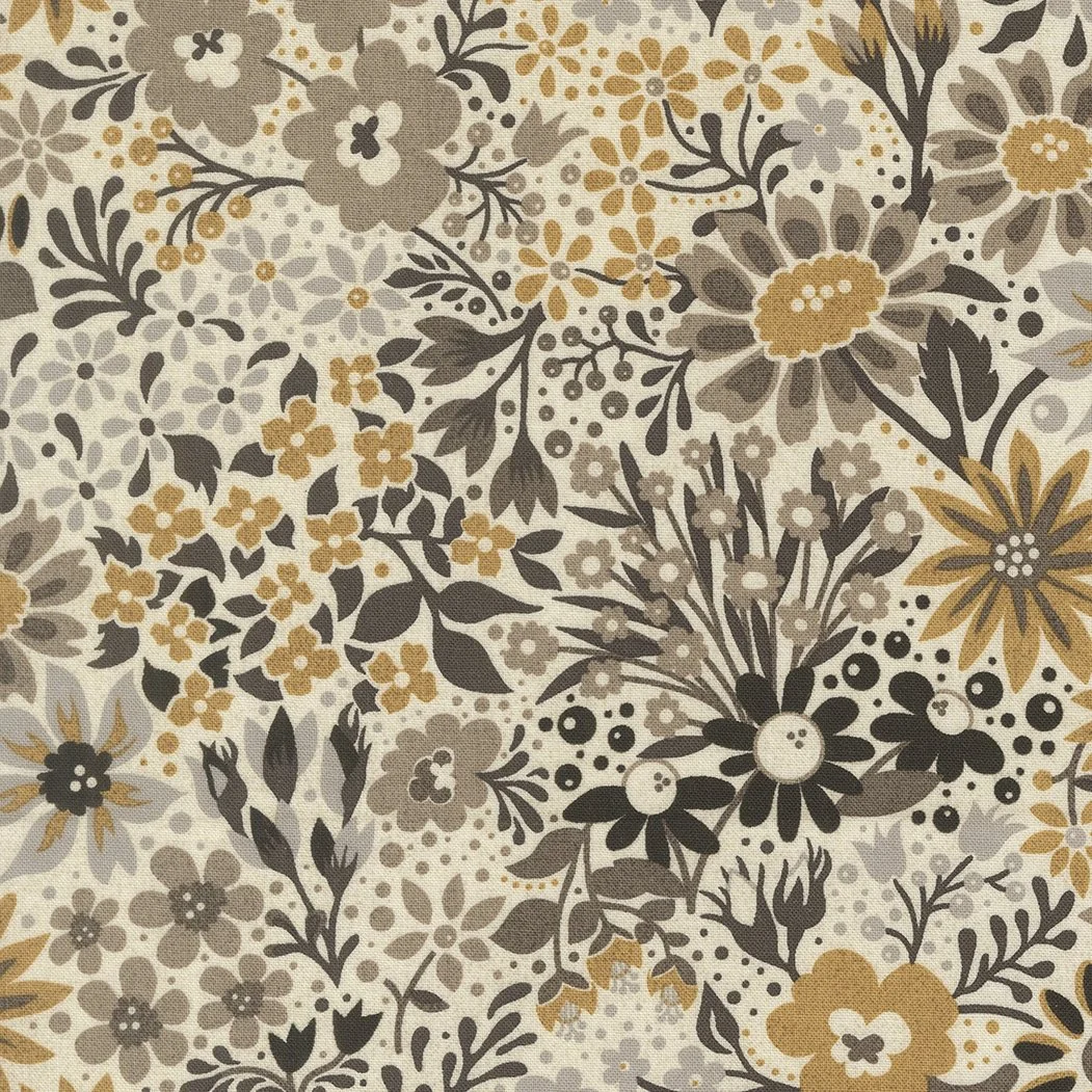 Patterned fabric featuring various flowers and leaves in shades of beige, brown, gray, and black.