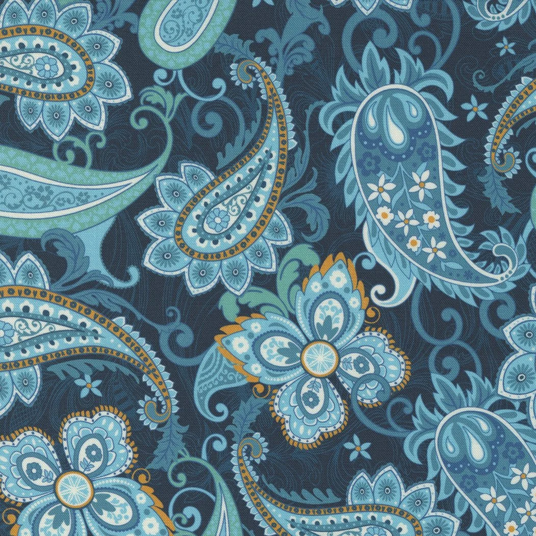 A textile fabric with a paisley pattern in shades of blue, teal, white, and orange, featuring floral and leaf motifs.