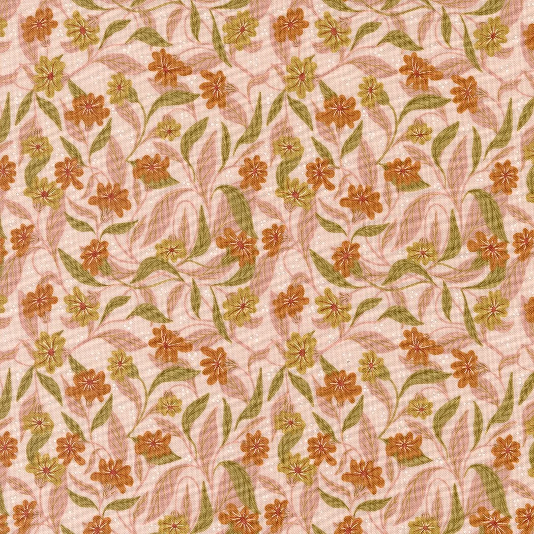Pink fabric decorated with small orange and yellow flowers and green leaves in a repeating pattern.