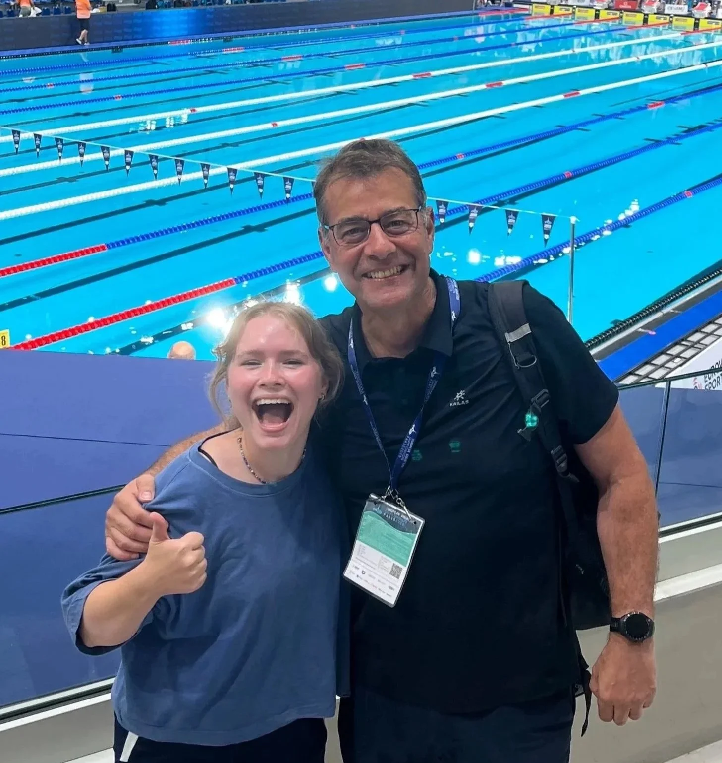 poppy rose and Andy Jameson smiling pool-side in Paris
