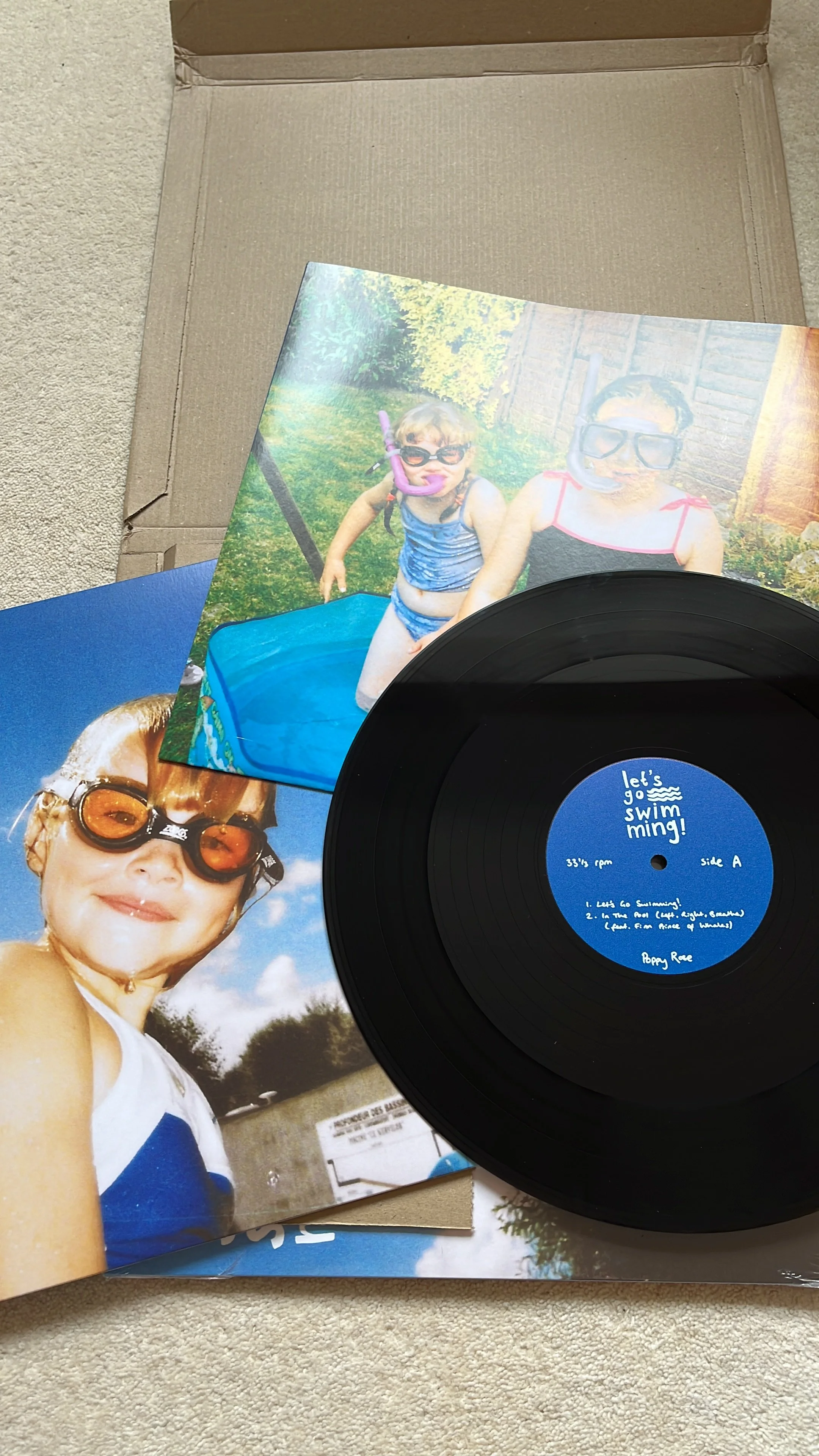 vinyl record of let's go swimming! by poppy rose