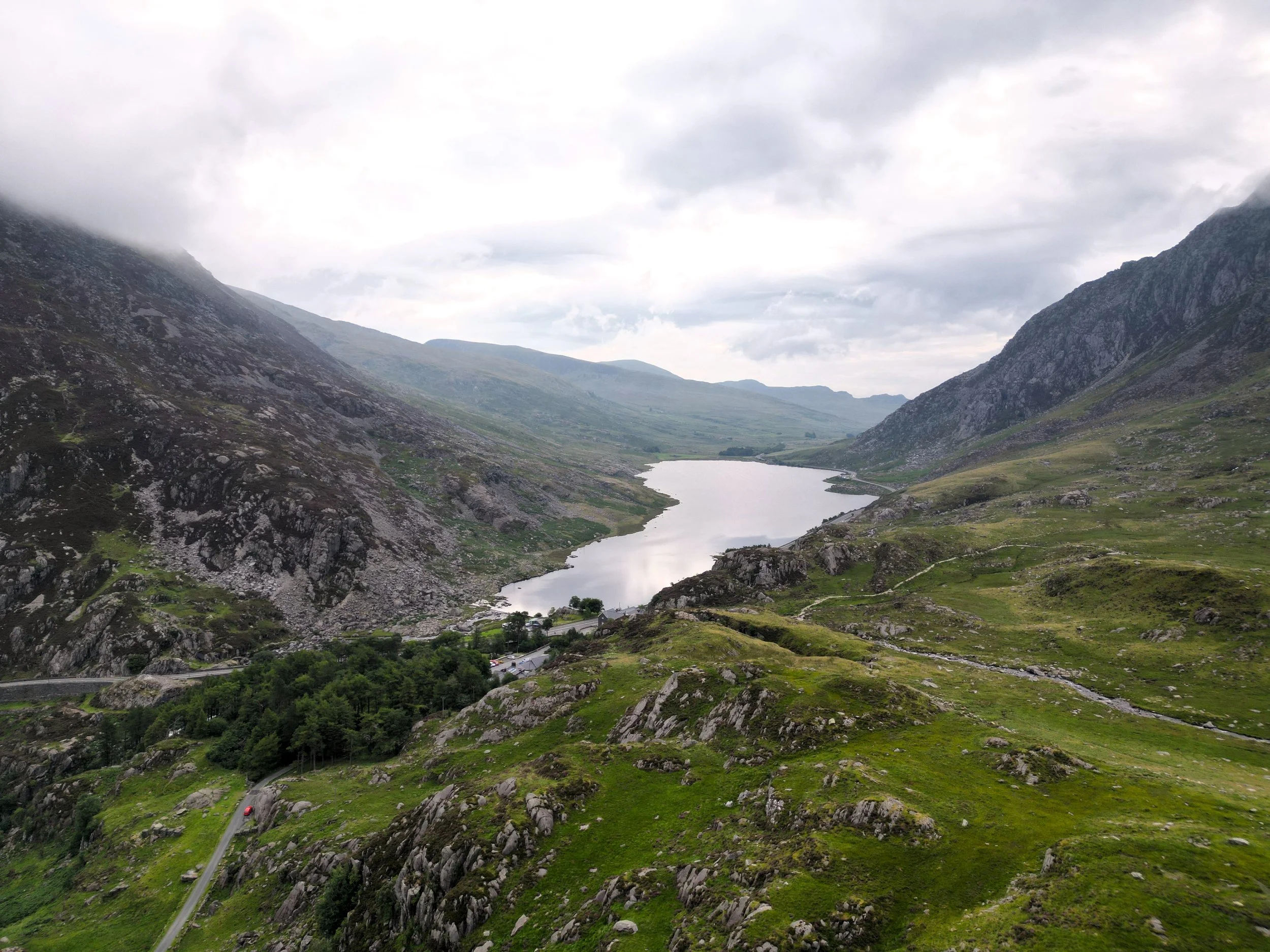 An aerial view of Llyn Ogwen in a mountain valley