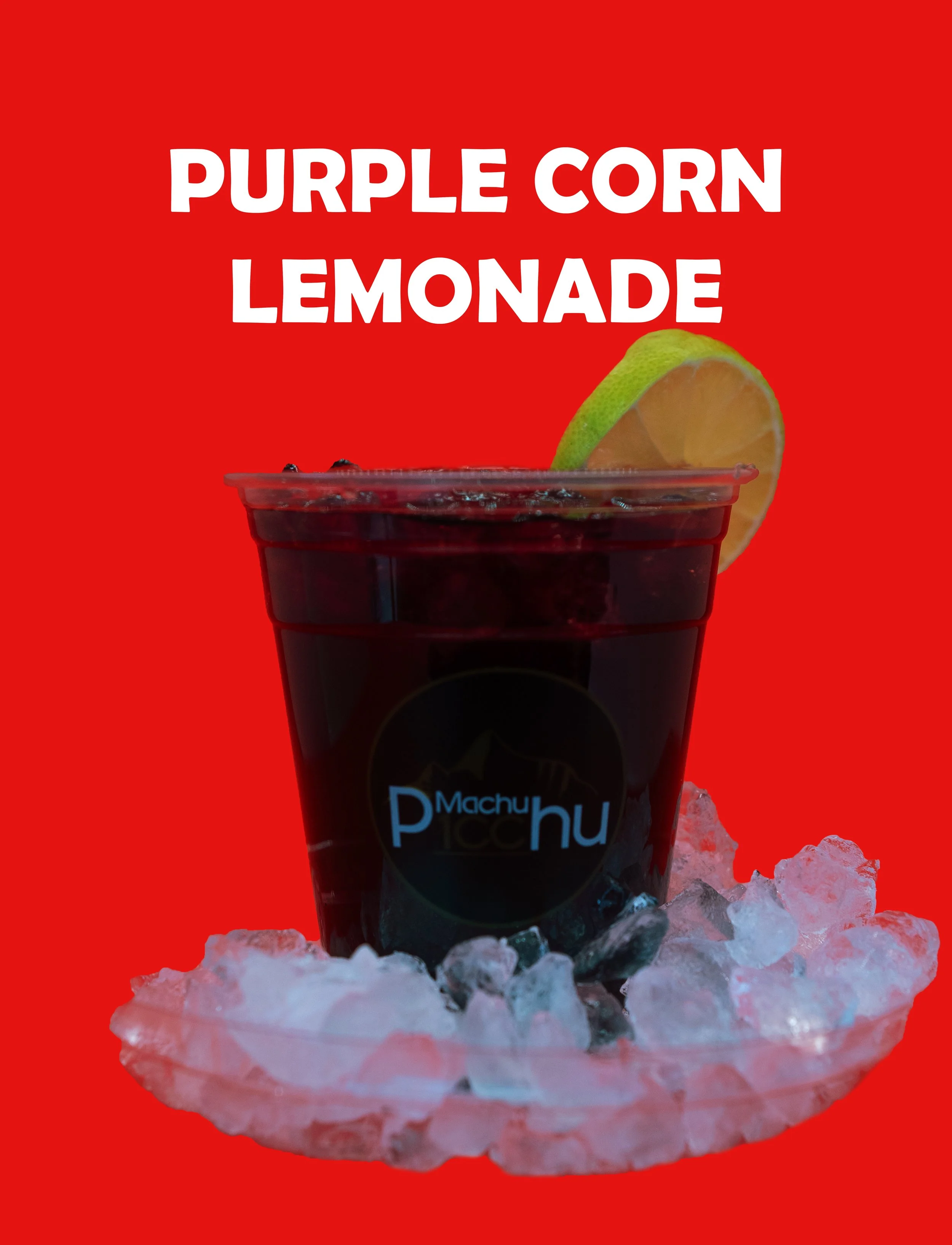 A cup of purple corn lemonade on ice, with a slice of lime, placed on crushed ice on a red background.