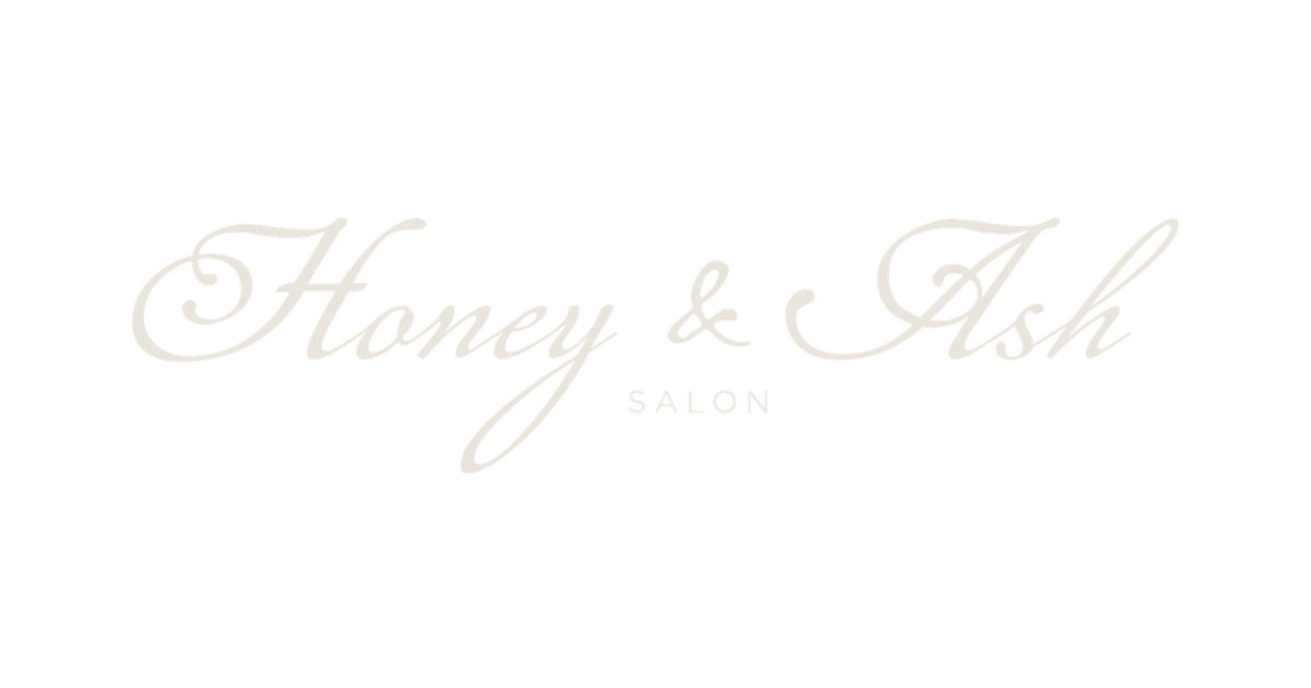 Logo for Honey & Ash Salon in elegant script with black background