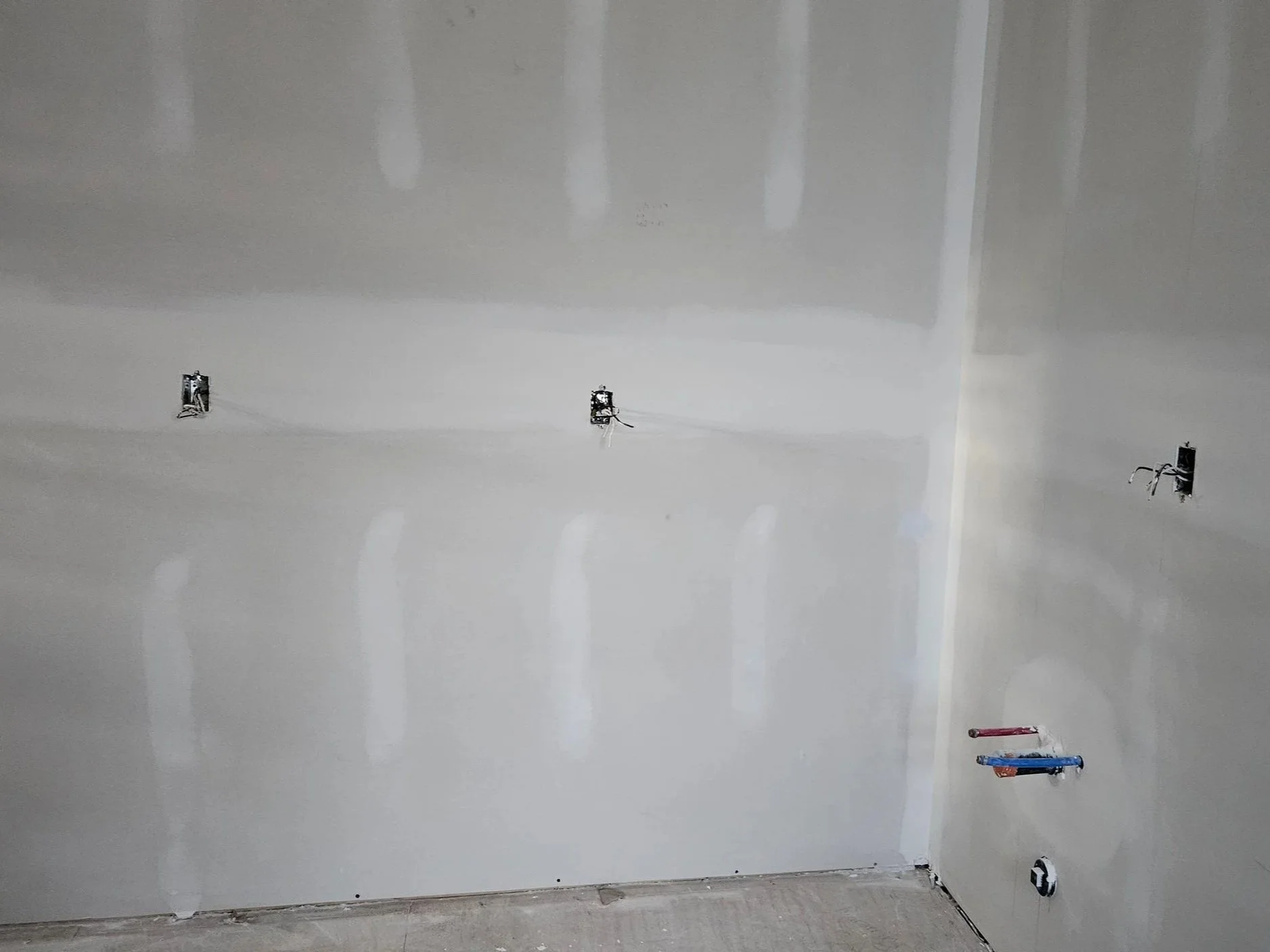 Garden suite kitchen wall boarded and taped with plumbing rough-in