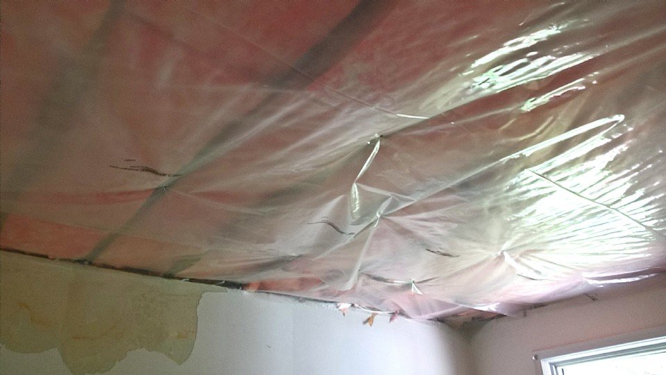 New insulation and vapour barrier installed in the opened ceiling