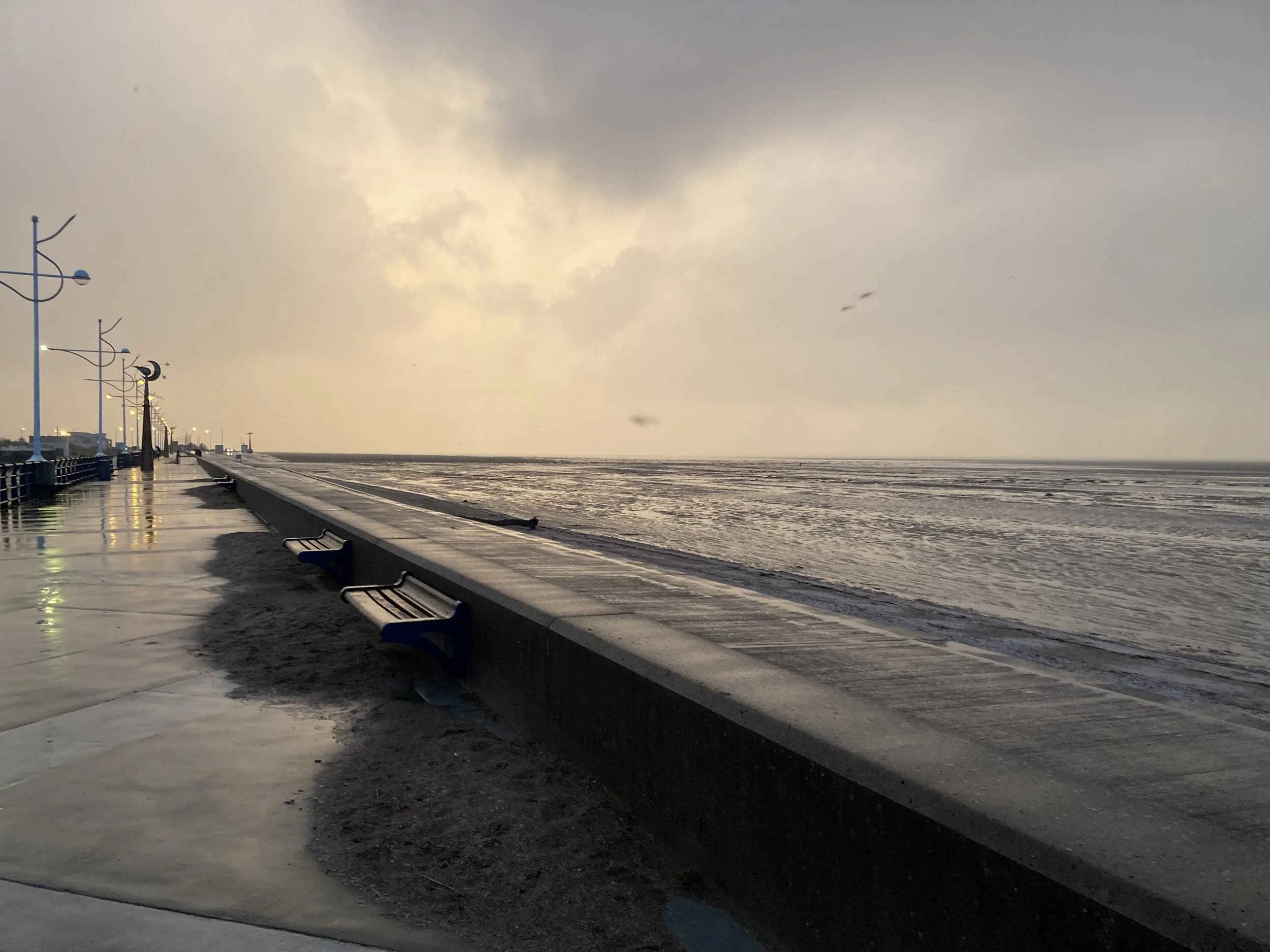 view of the sea and benches from Southport promenade