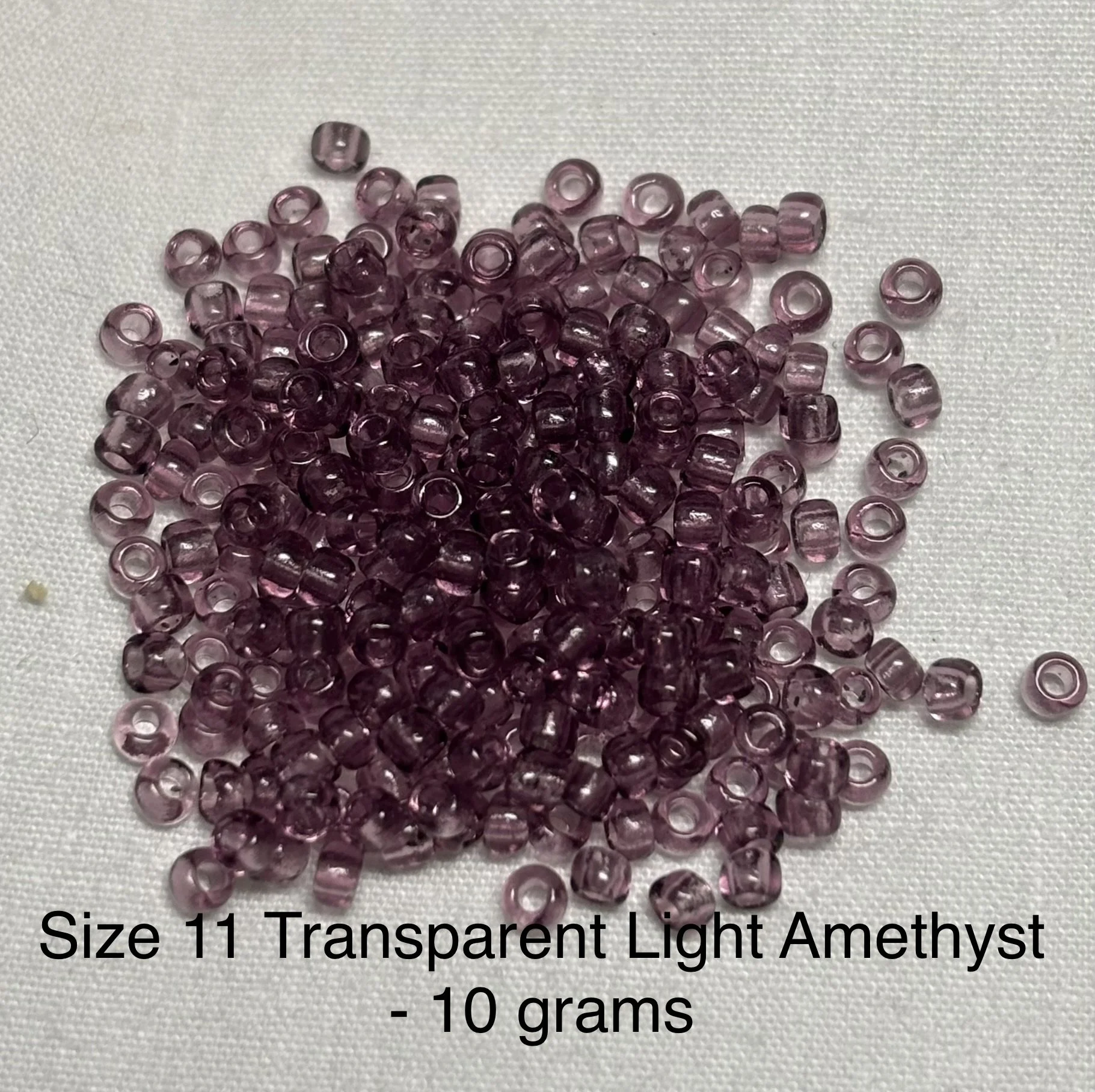 11/0 Antique Transparent Light Amethyst