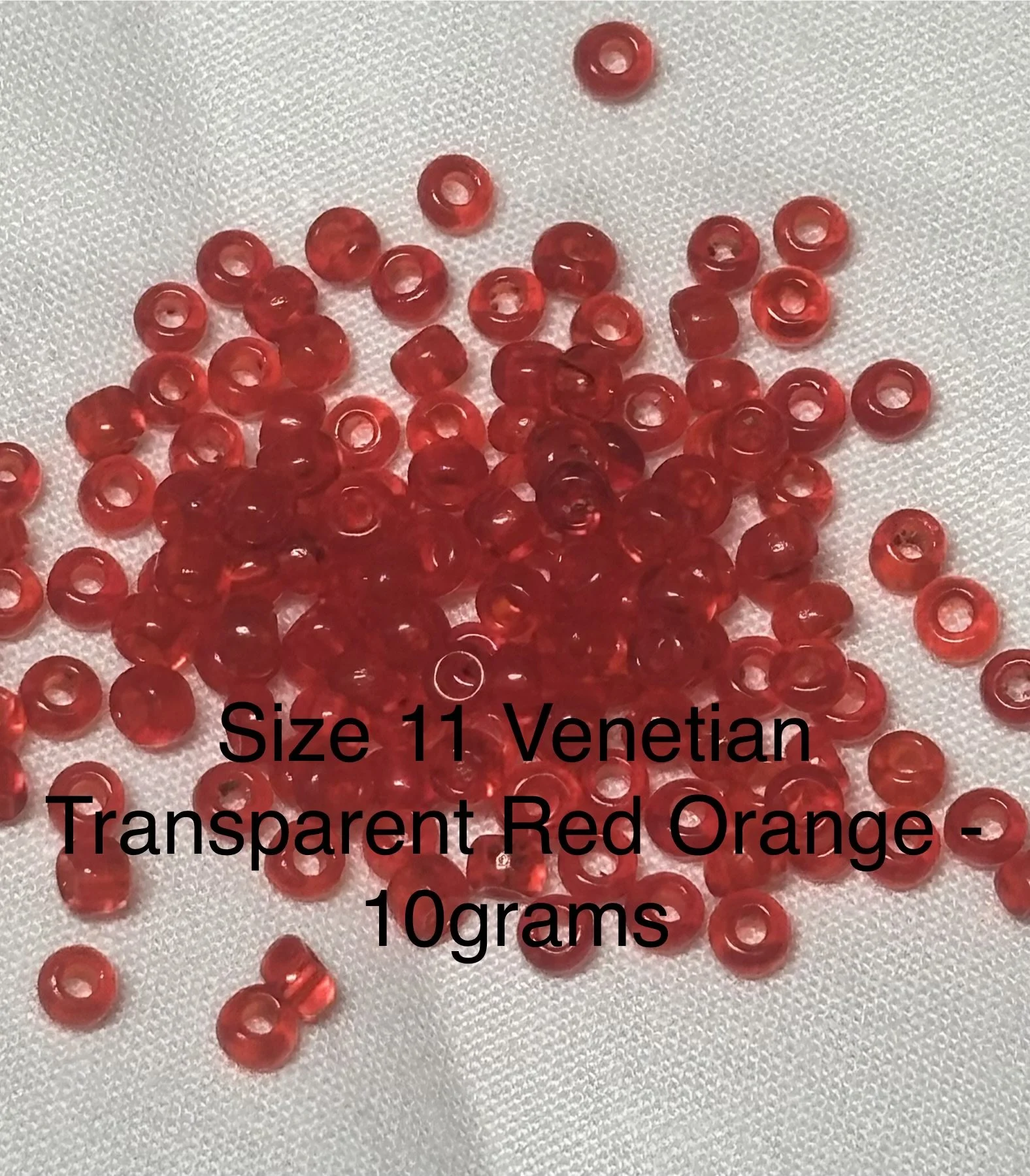 11/0 Antique Transparent Red Orange