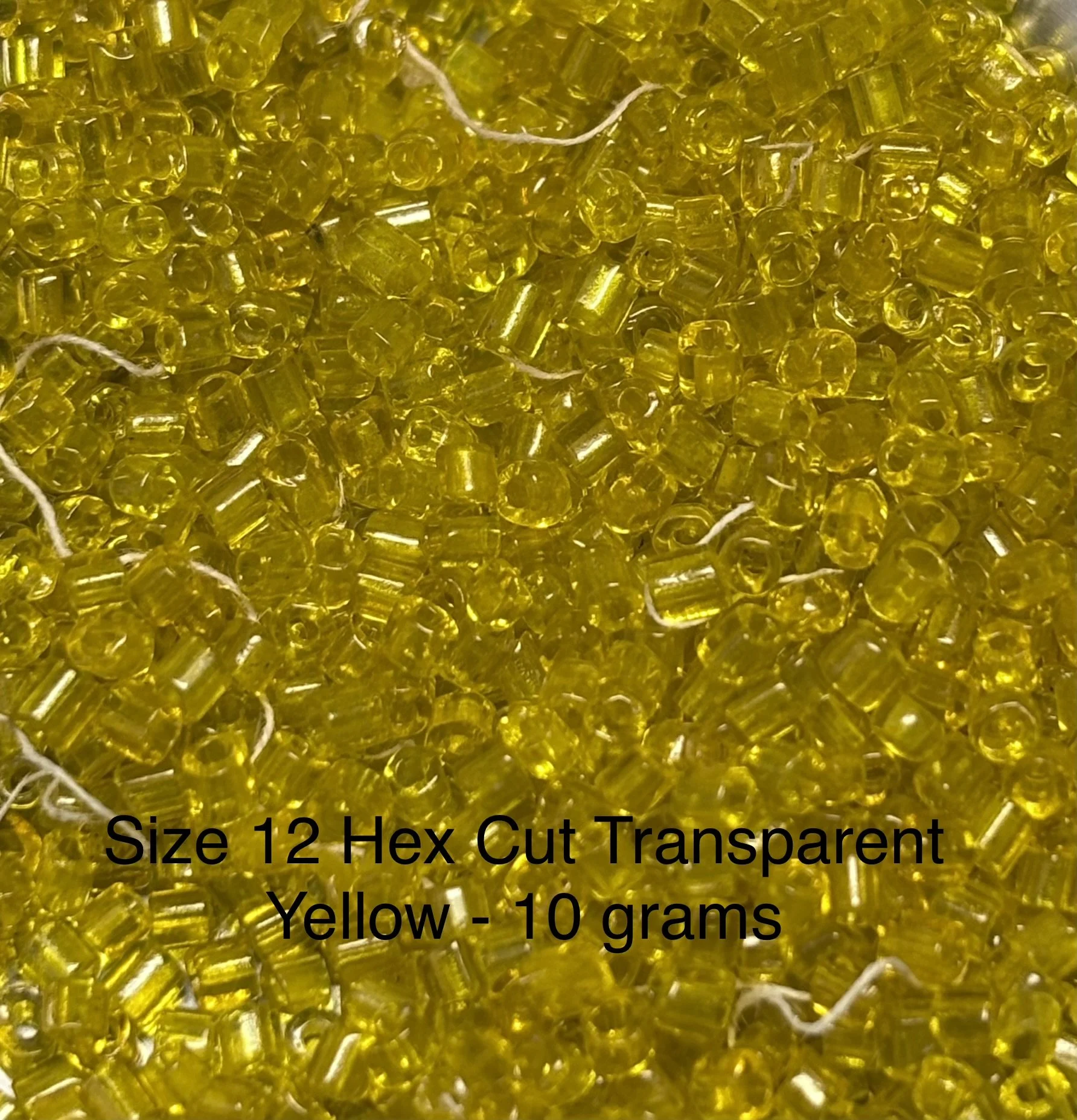 12/0 Antique Hex-Cut Transparent Yellow