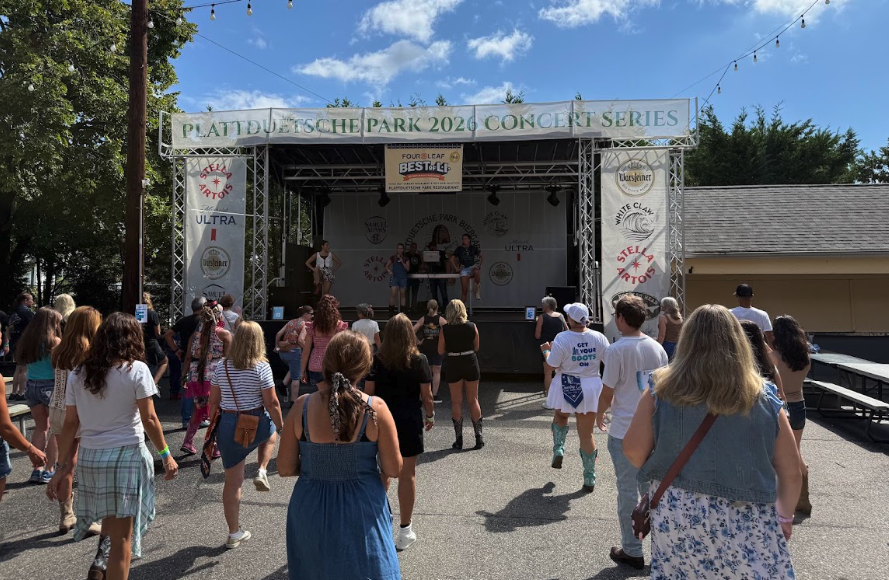 People attending an outdoor line dance festival on Long Island