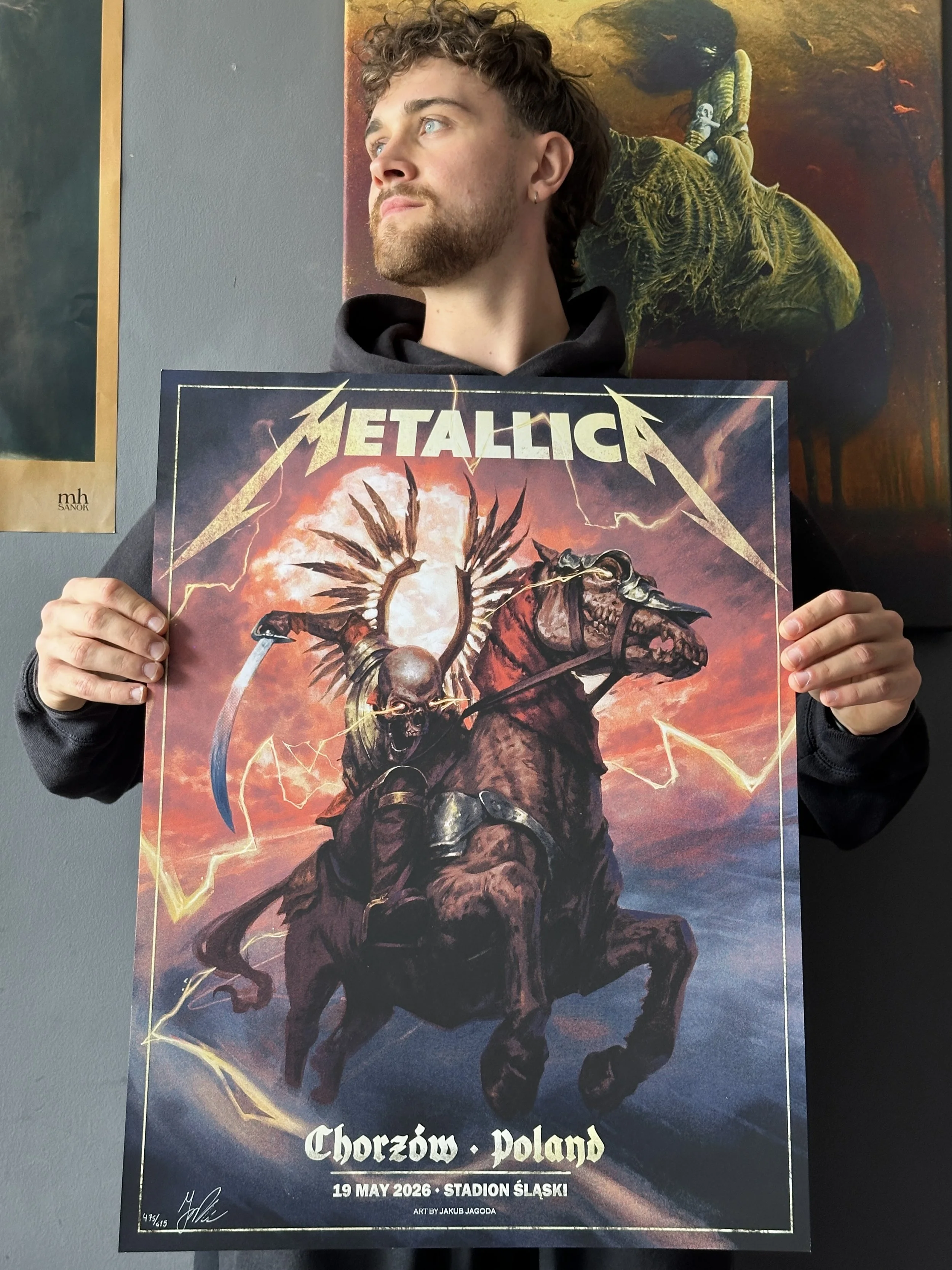 jakub jagoda standing with his metallica poster