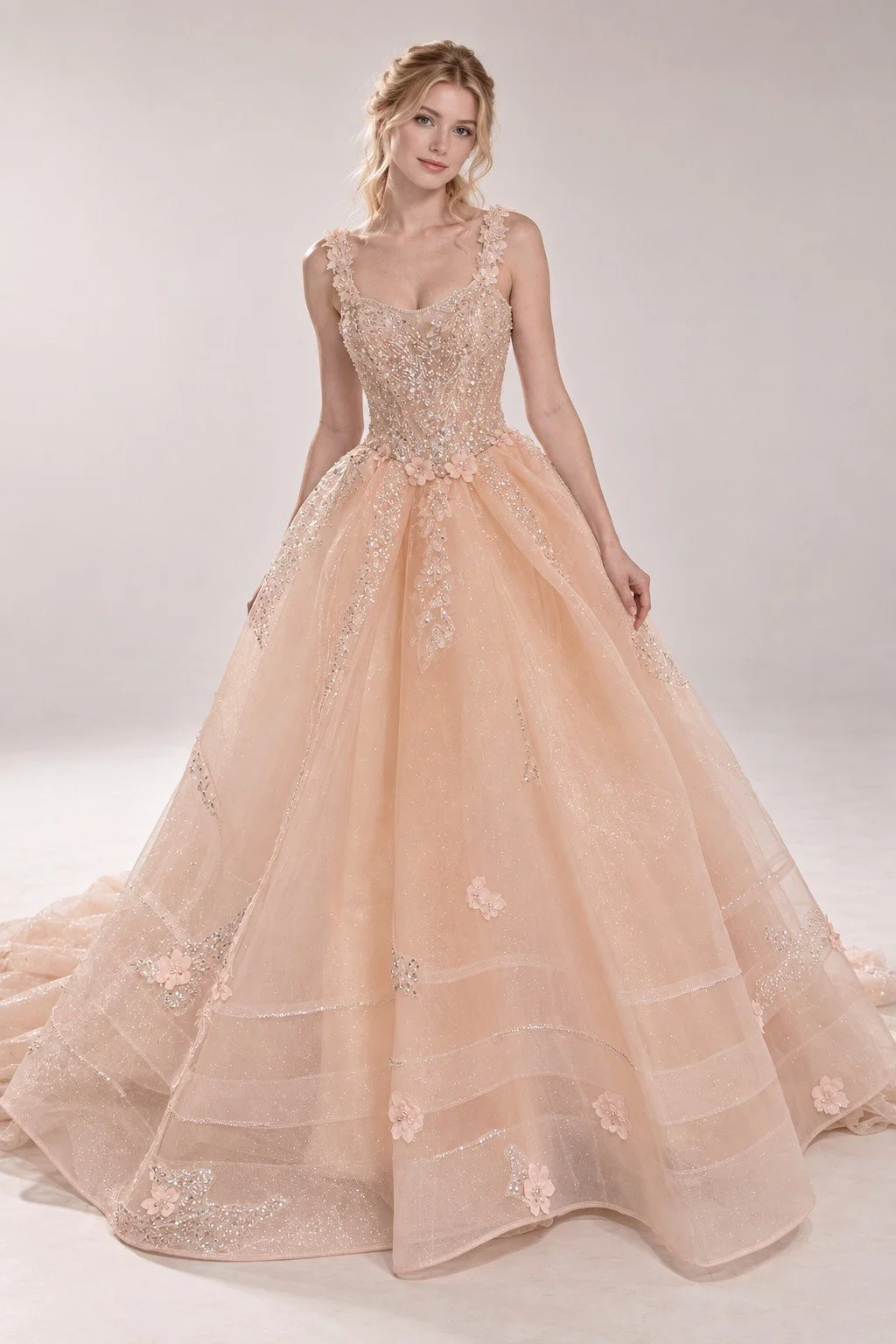 A woman in a peach-colored, full-length, sleeveless ball gown with intricate lace and floral embellishments.