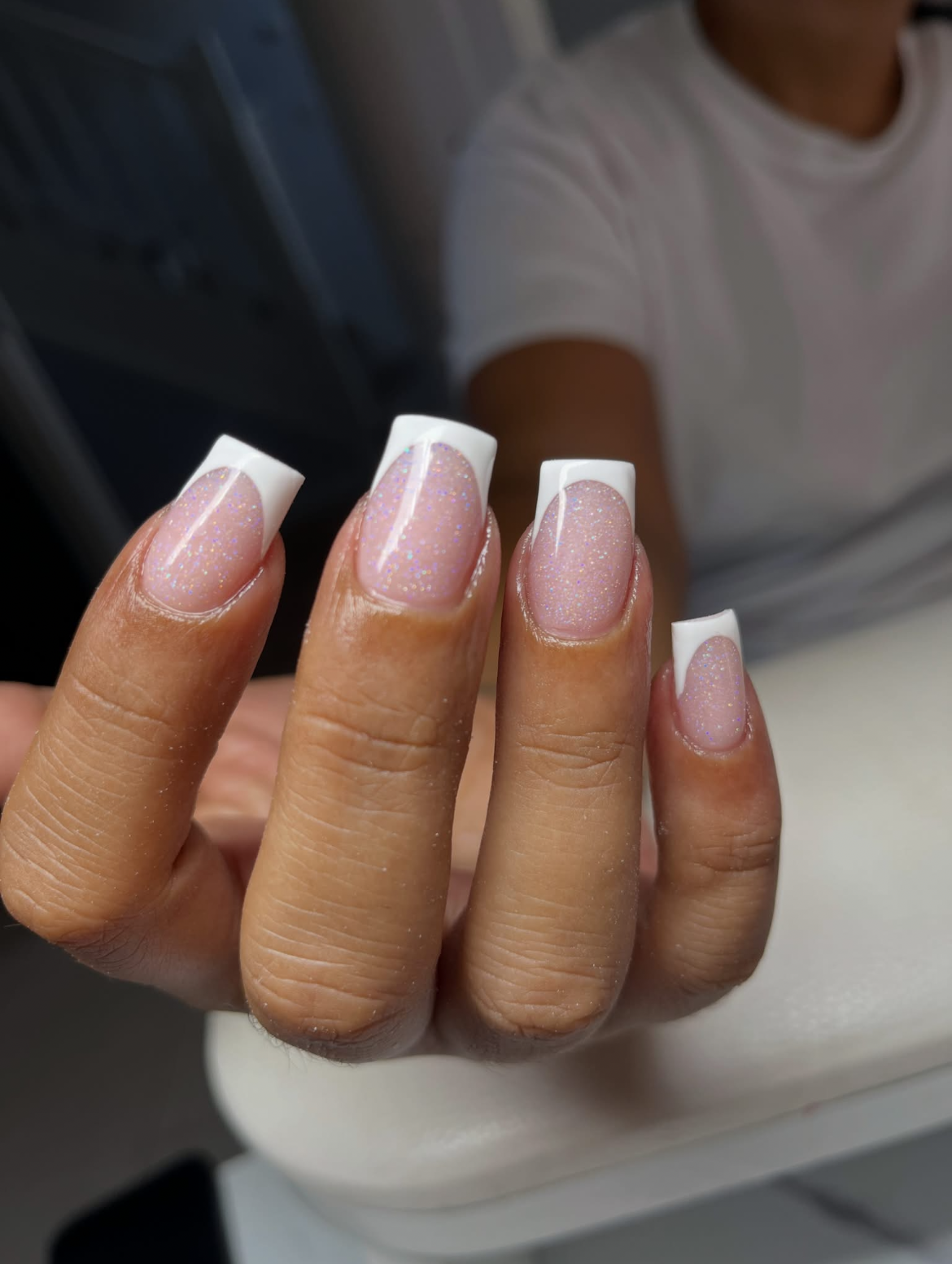White French-tip square nails with a soft glitter-pink base.