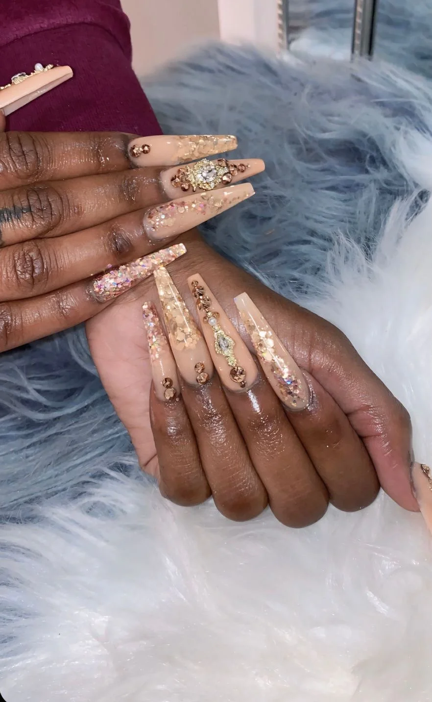 Nude coffin nails with rose-gold glitter, crystals and jeweled details.