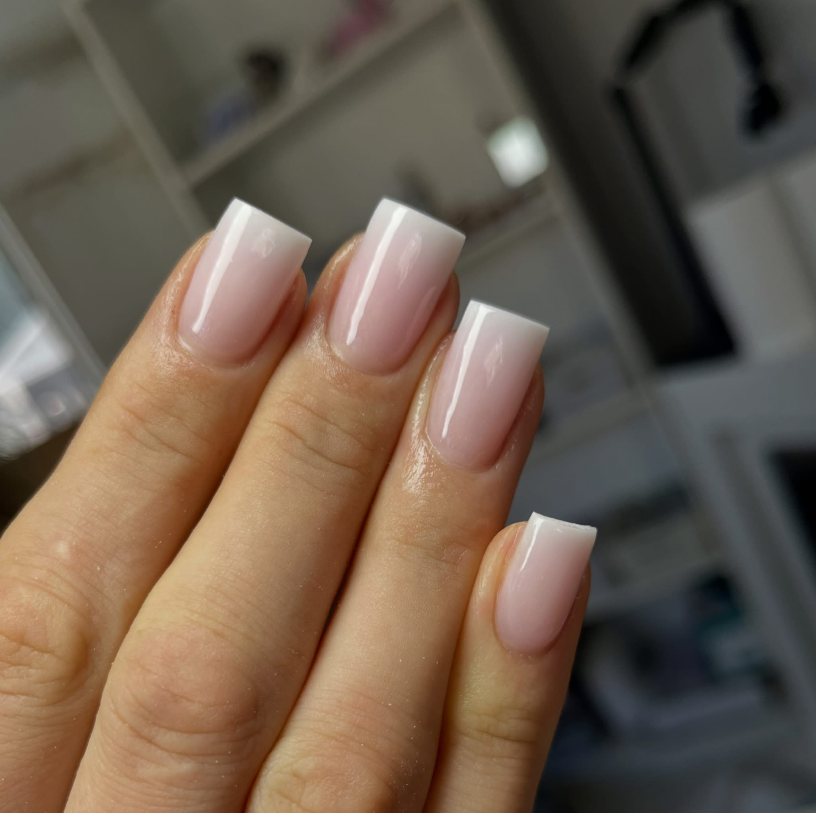 Milky-pink square nails with a clean, glossy finish.
