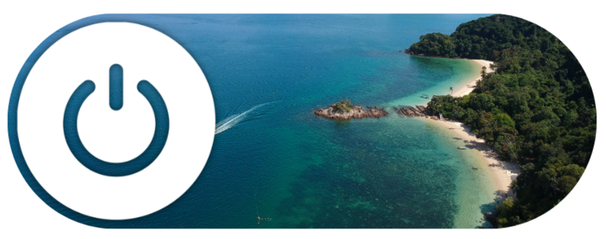 A scenic aerial view of a tropical beach with clear blue water and lush green trees.