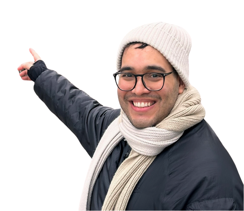 A smiling man in glasses, a beanie, and a scarf pointing to the left, wearing a dark jacket, with a colorful graphic background.