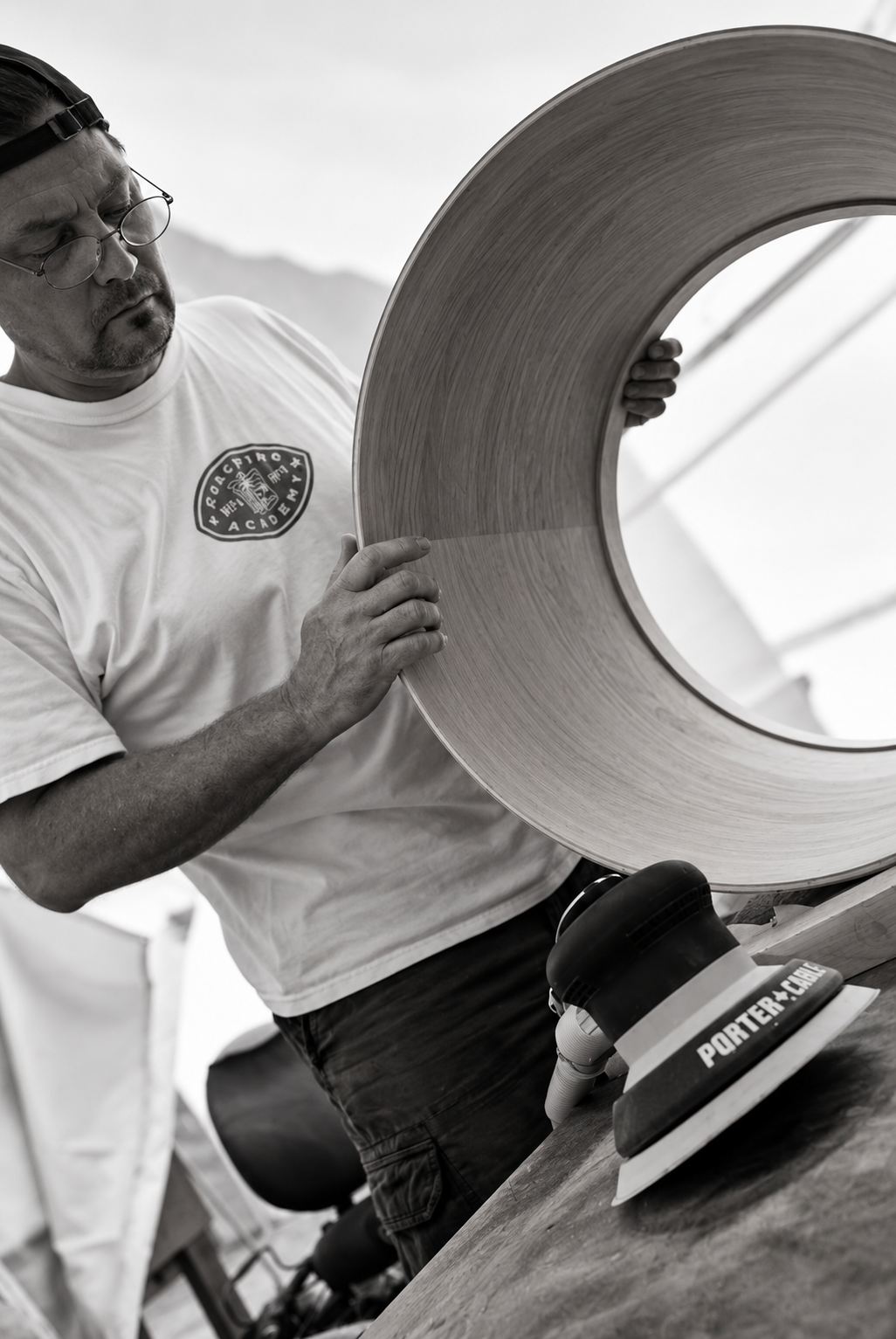 Craftsman Inspecting a Wooden Drum Shell.png