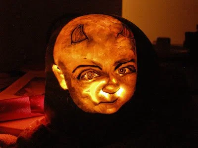 Wendy’s second carving from October 2007: a baby portrait with little devil horns, lit from inside