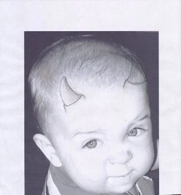 Photo of Wendy’s baby nephew with horns drawn on, the reference for the second carving