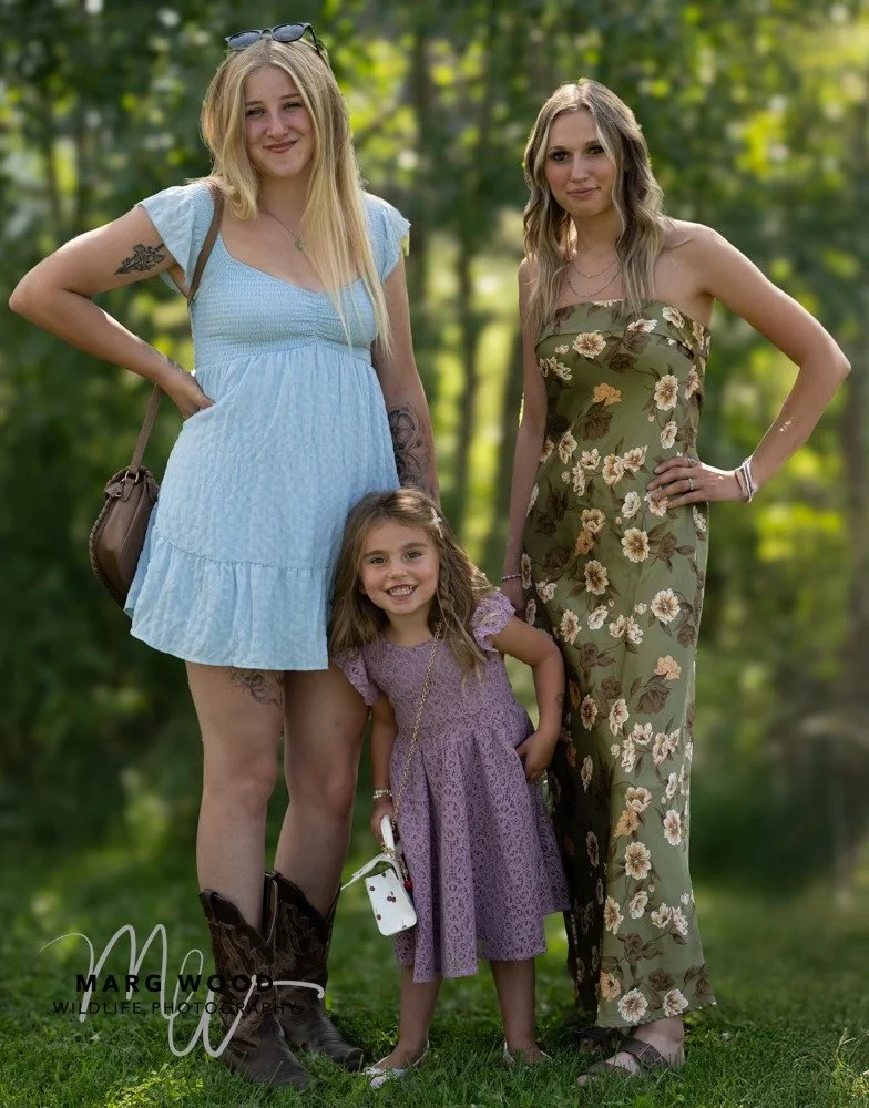 Hailey and Madison with their younger sister Karlee outdoors in Alberta.