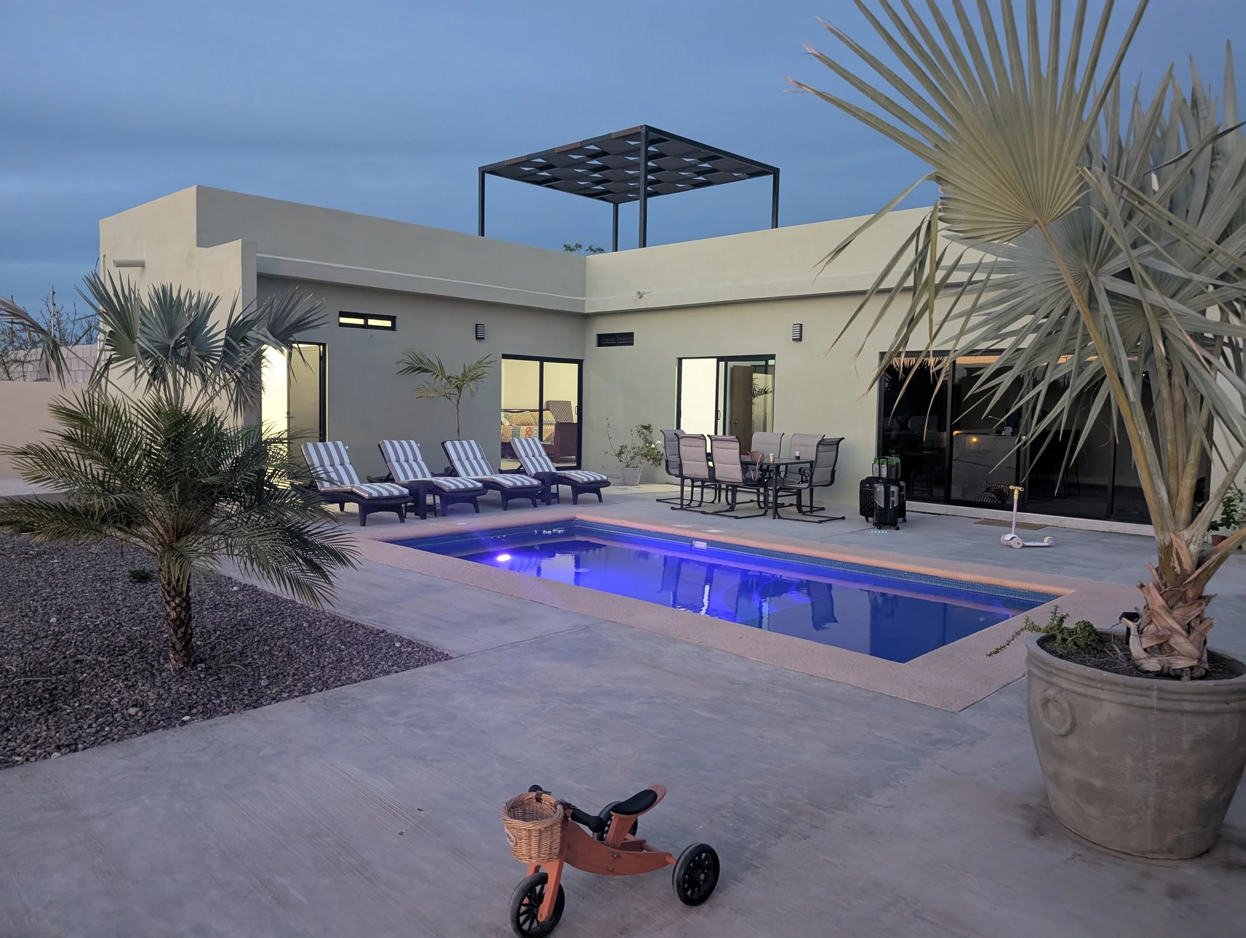Anna and her family’s home in La Paz, Baja California Sur, Mexico, with the backyard pool illuminated at dusk.