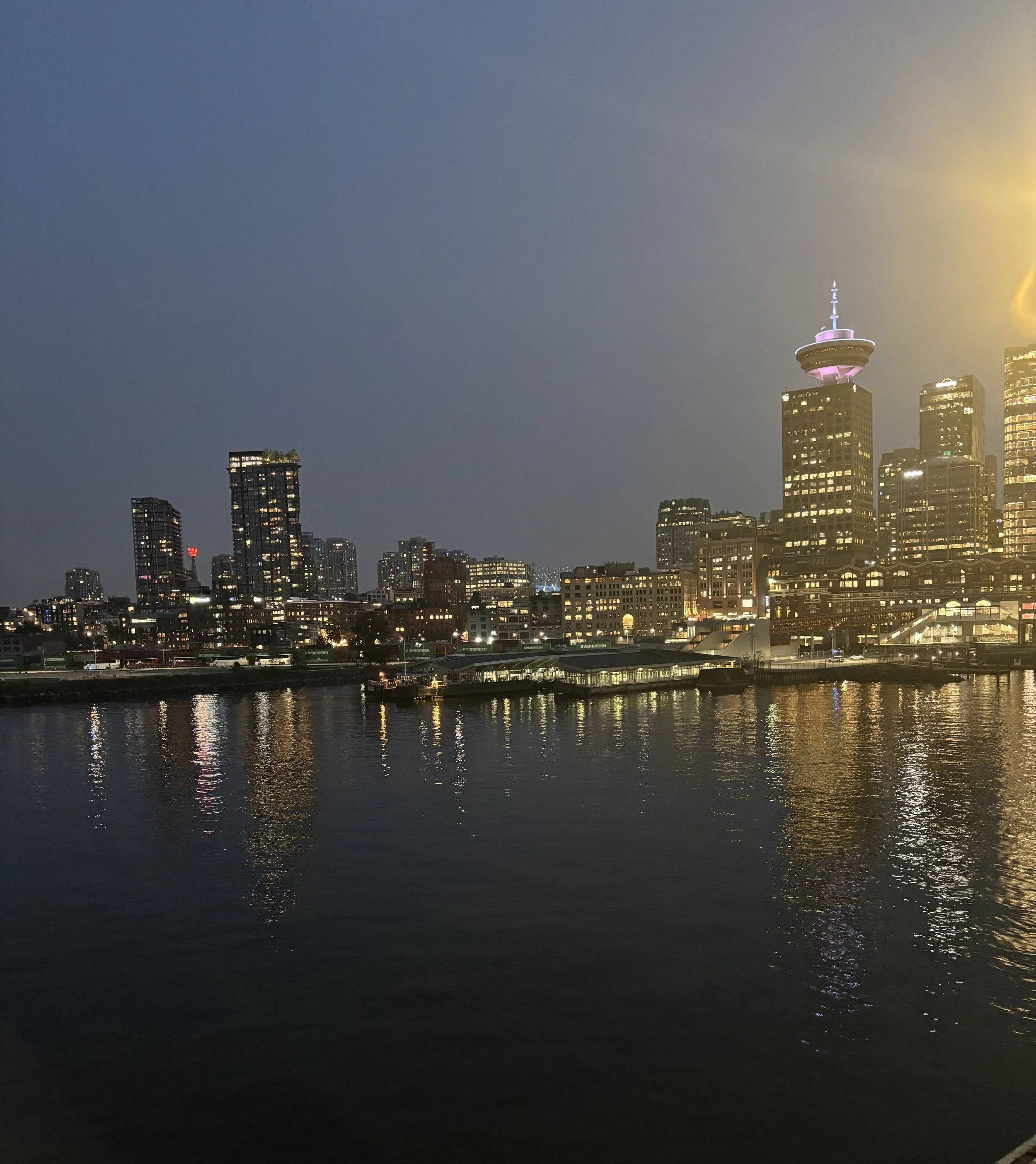 Vancouver skyline at night, where Anna and John travelled to meet the Mexico Mortgage Hub team before Anna joined.