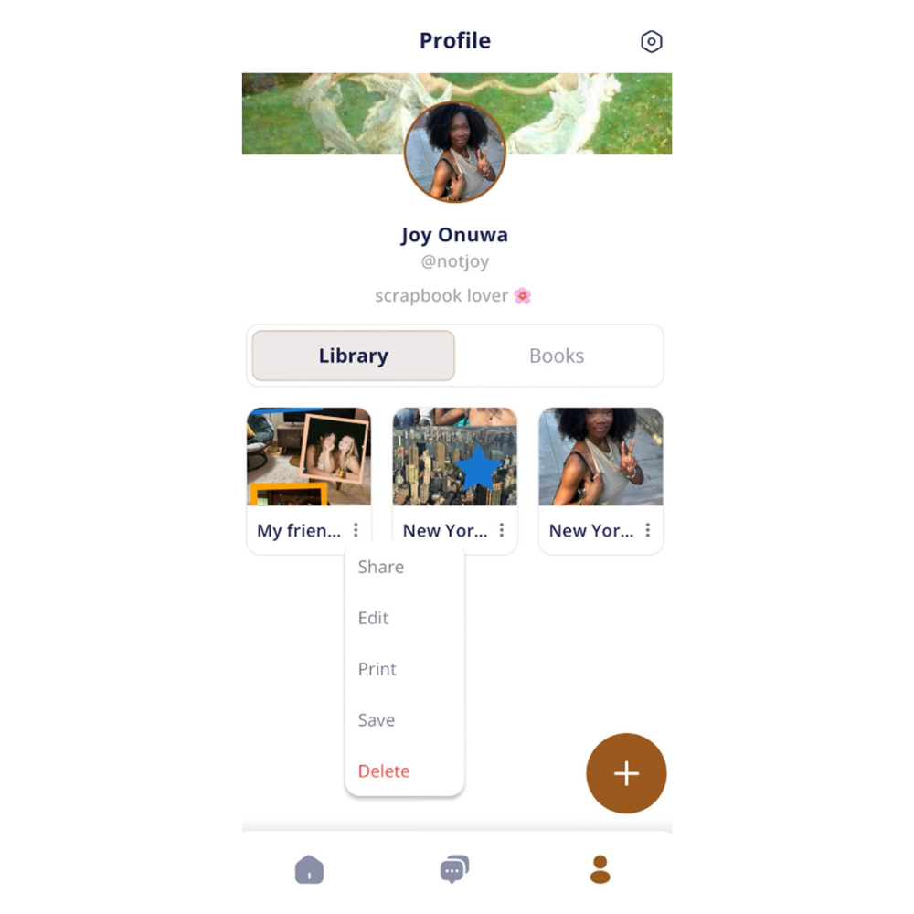 Mobile app profile screen showing user Joy Onuwa's profile with a cover photo of two women dancing in a park and a profile picture of a woman with curly hair making a peace sign. The screen lists photo albums titled "My friends" and "New York" with options to share, edit, print, save, or delete.