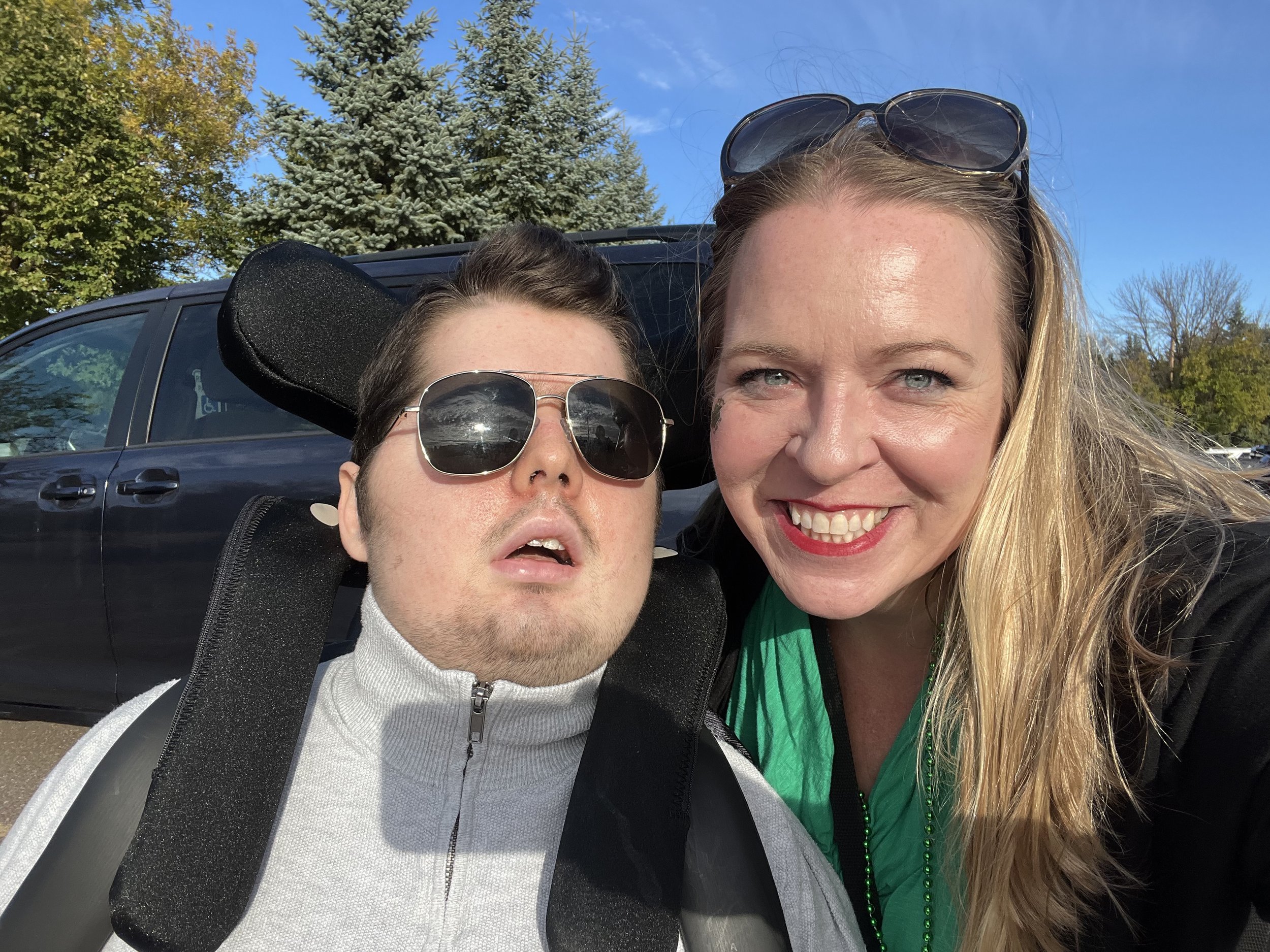 Brady Swenson joined by an attendee of the 4th Annual Brady Swenson Lucky 13 Golf Tournament, supporting organizations that have provided meaningful care to kids like Brady, experiencing life-threatening injuries and illnesses.