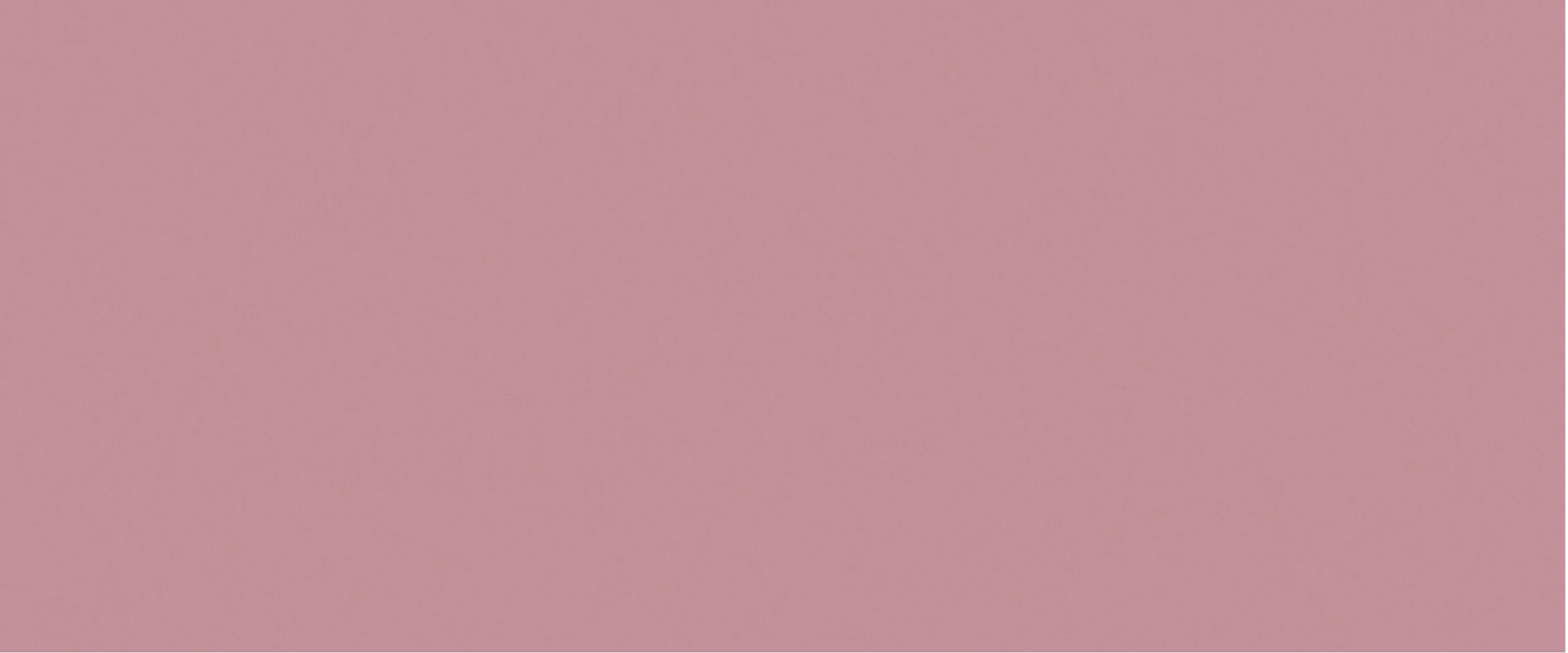 En ensfarget lys rosa bakgrunn