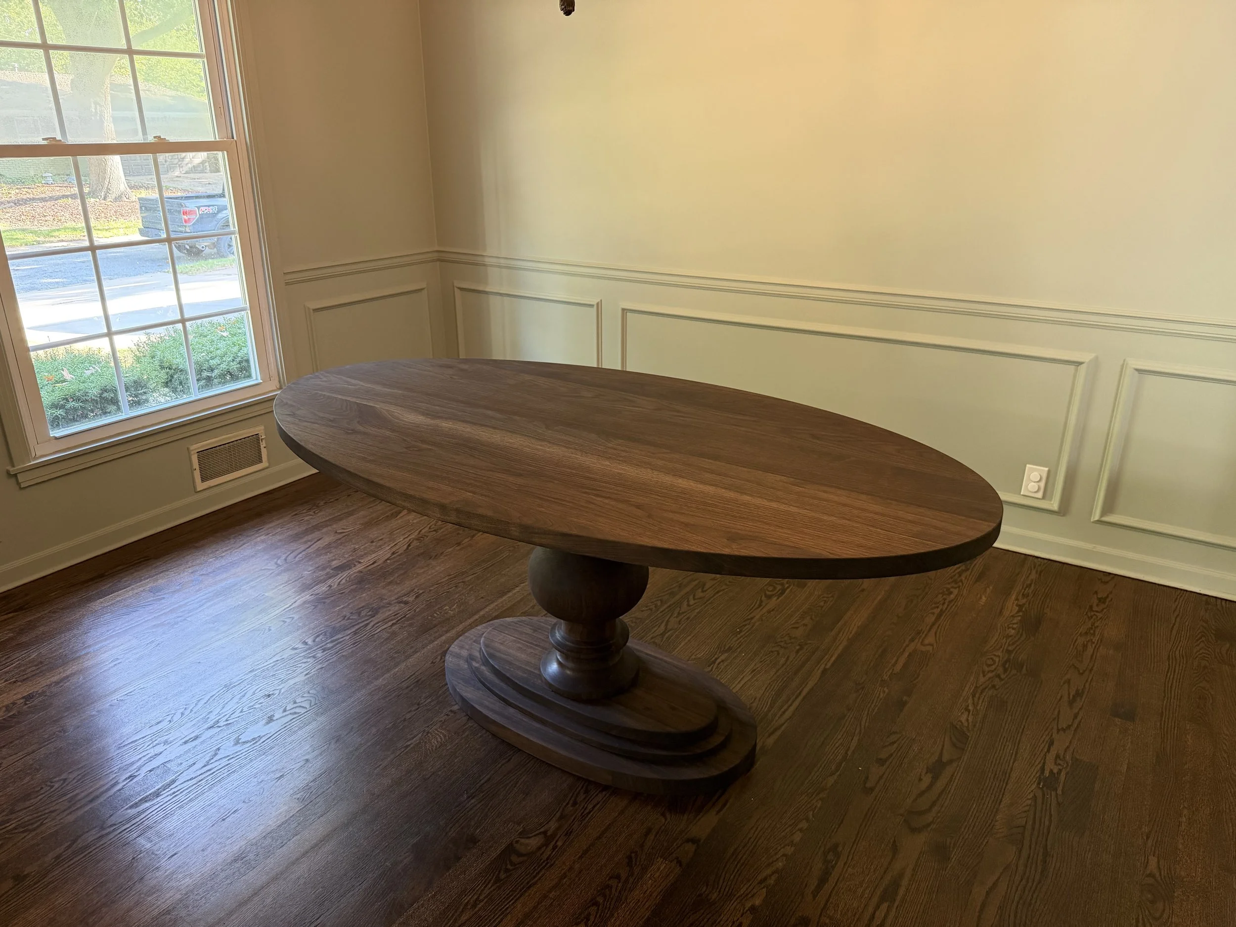 Custom oval hardwood dining table built by JK Table Co.