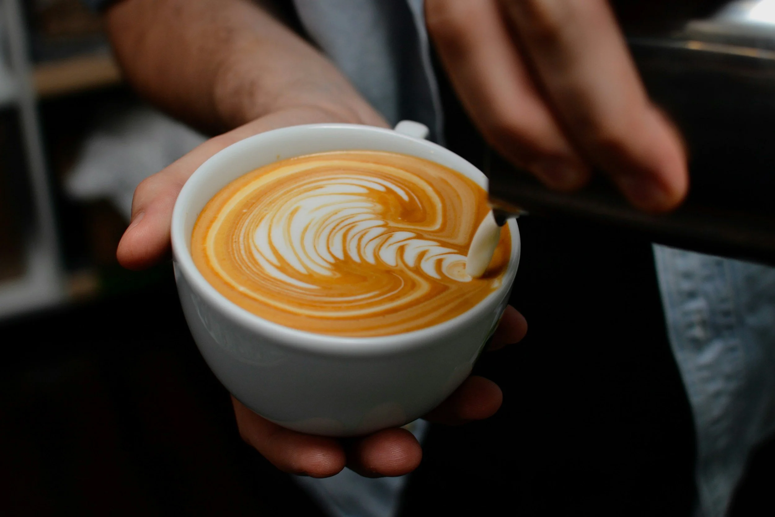 Beautiful latte art with fresh espresso and velvety steamed milk
