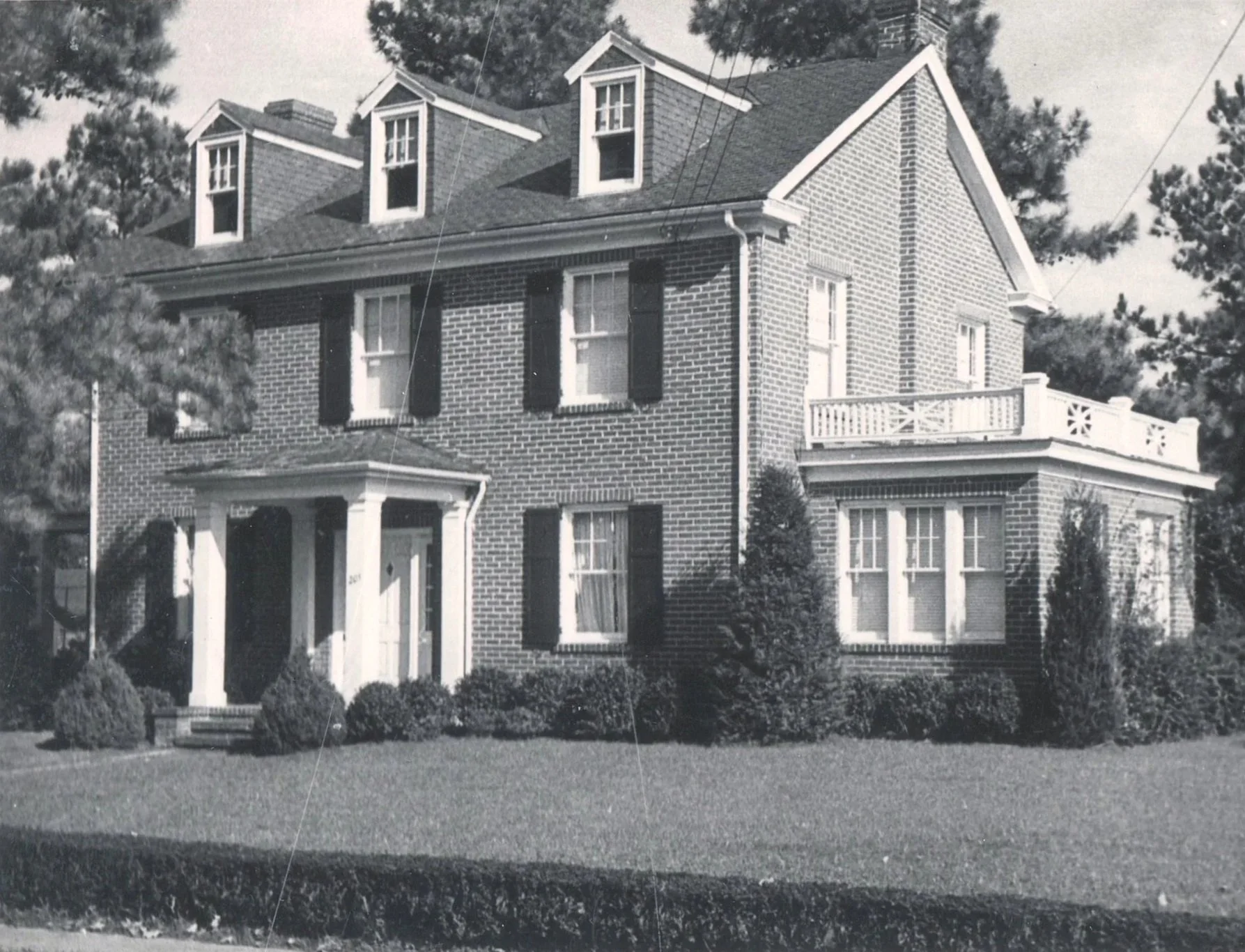 Antique black and white photo of a brick victorian home, genealogy research. © Butterworth Research