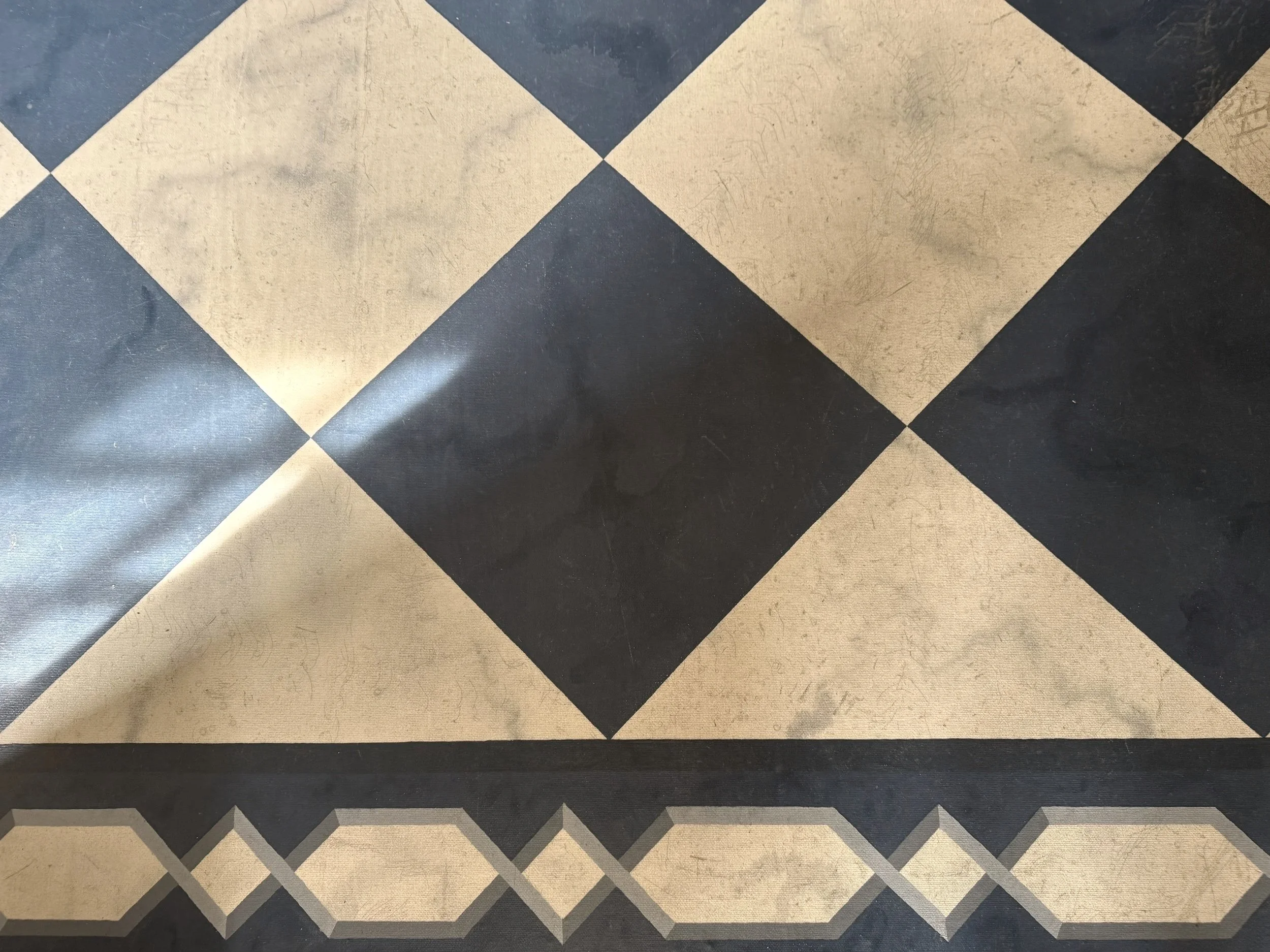 Ornate Victorian-era black and white tile floor  – genealogy research. © Butterworth Research