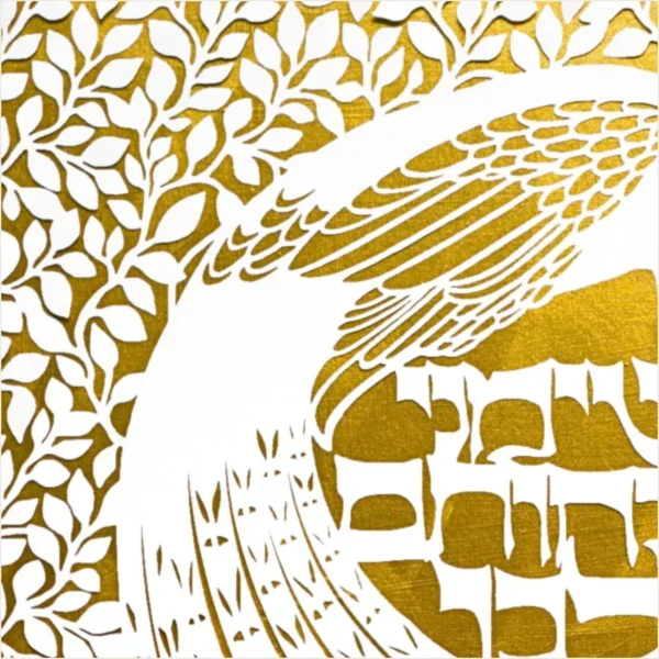 Close up of a golden paper cut design featuring a peacock among intricate botanical patterns and the text in Hebrew for "Set me like a seal upon your heart" from Song of Songs