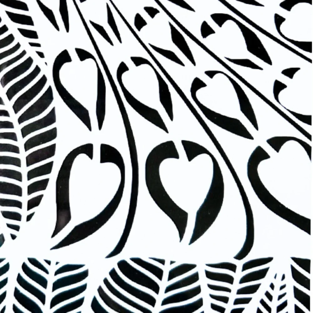 close up of art nouveau peacock feathers papercut art